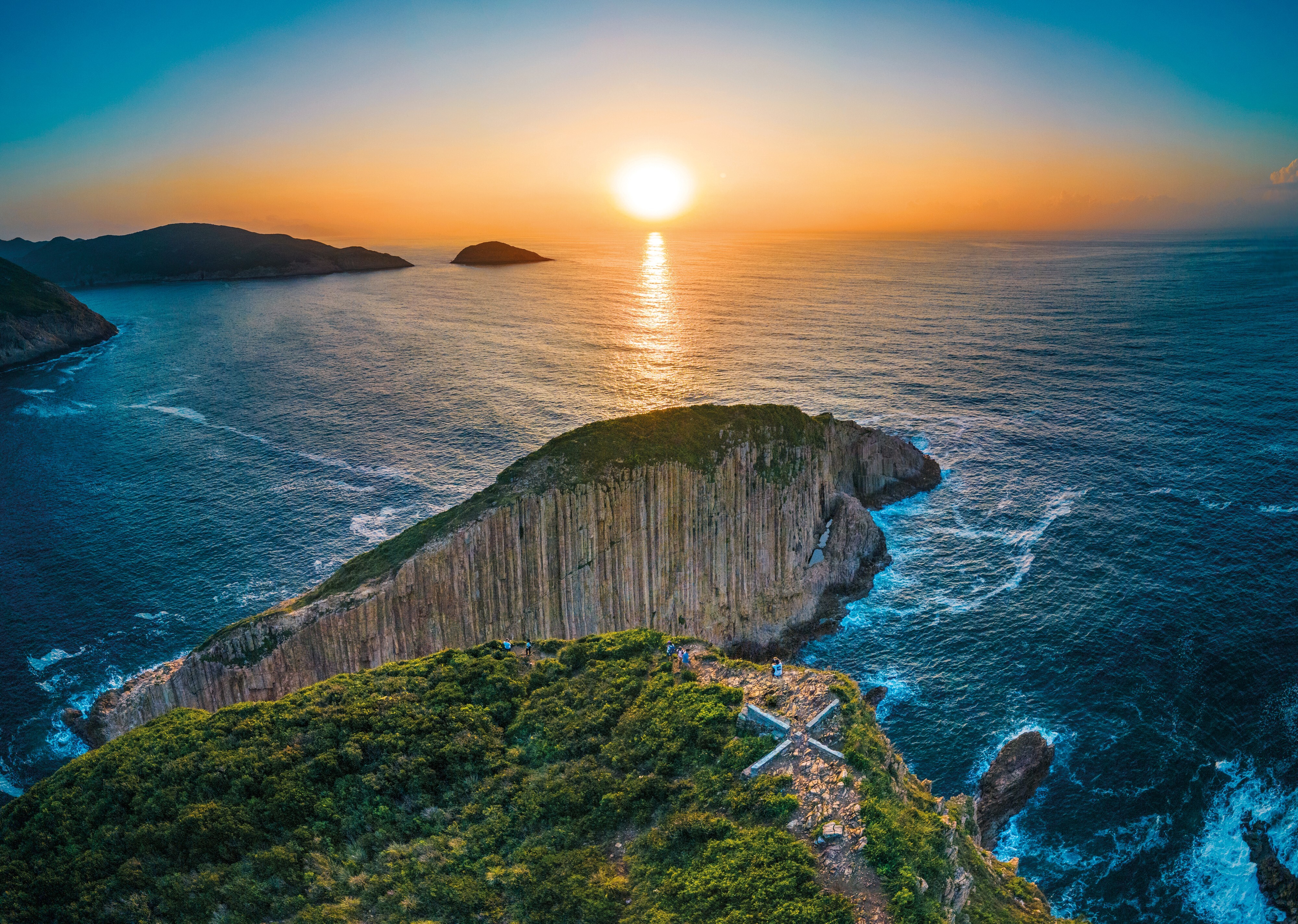 Sunset over Hong Kong’s triangular Po Pin Chau sea stack – separated from the Fa Shan headland by sea erosion – close to High Island Geo Trail in eastern Sai Kung Peninsula.