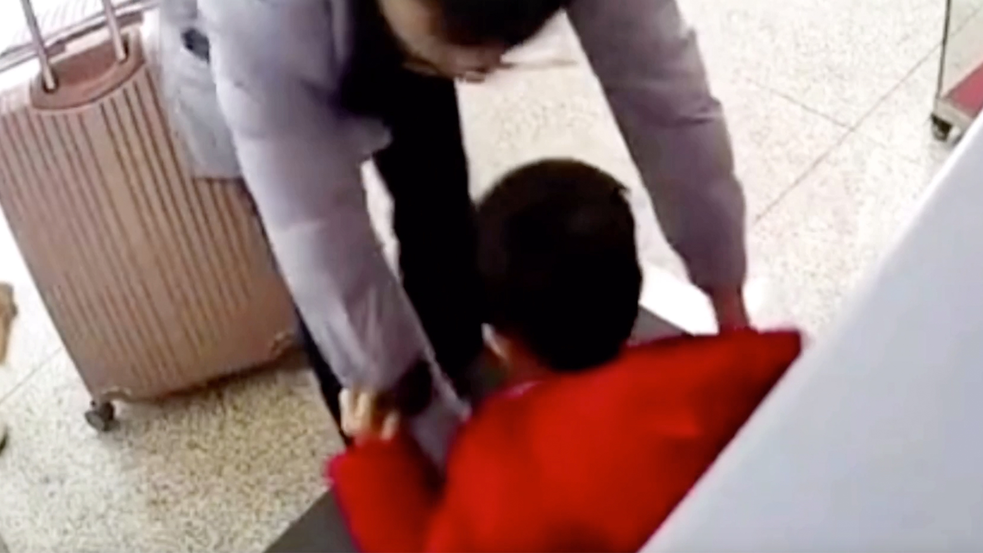 Chinese father rushing for train puts son on security scanner