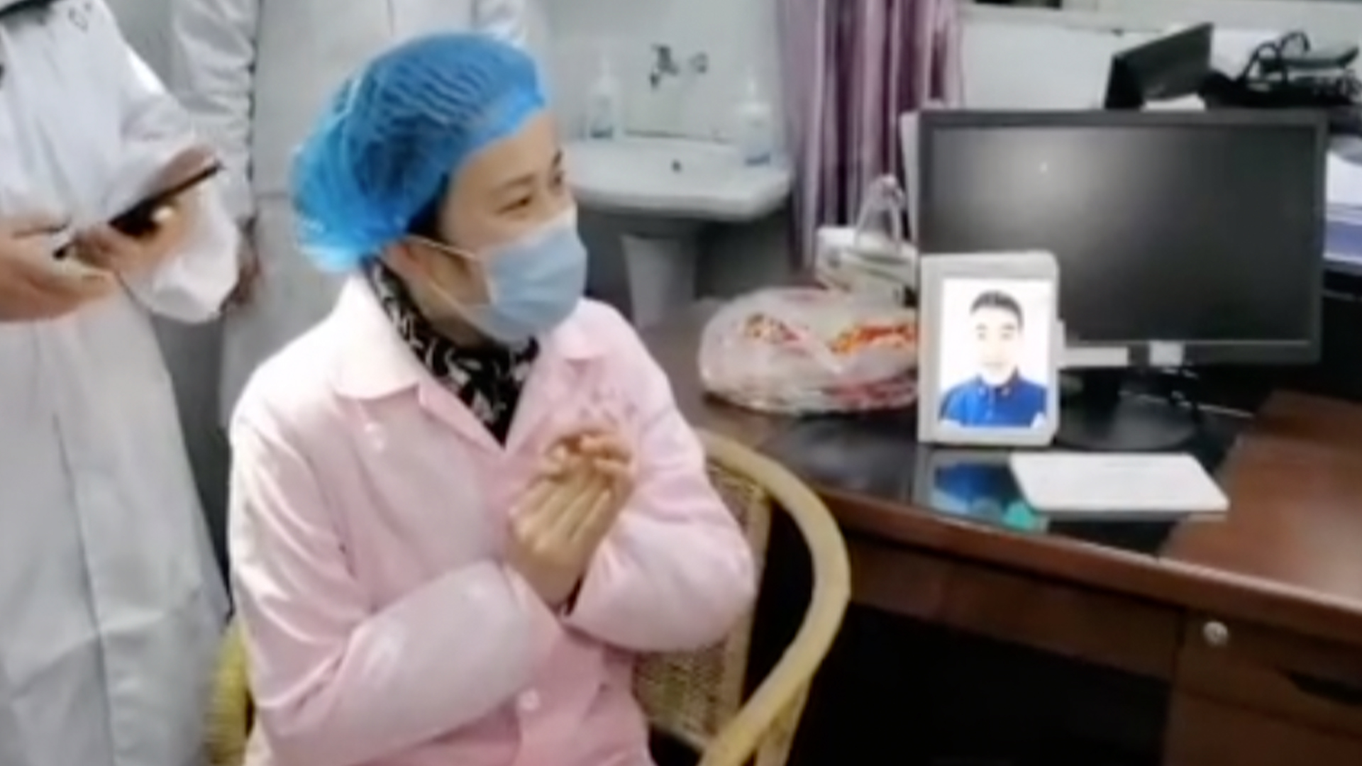 Two frontline workers fighting against coronavirus in China get married over a video call