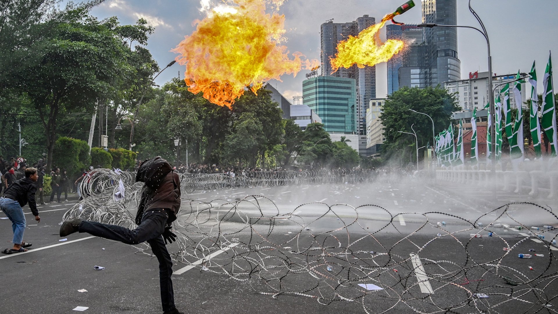 Indonesian demonstrators and police clash during Surabaya protest against new military law