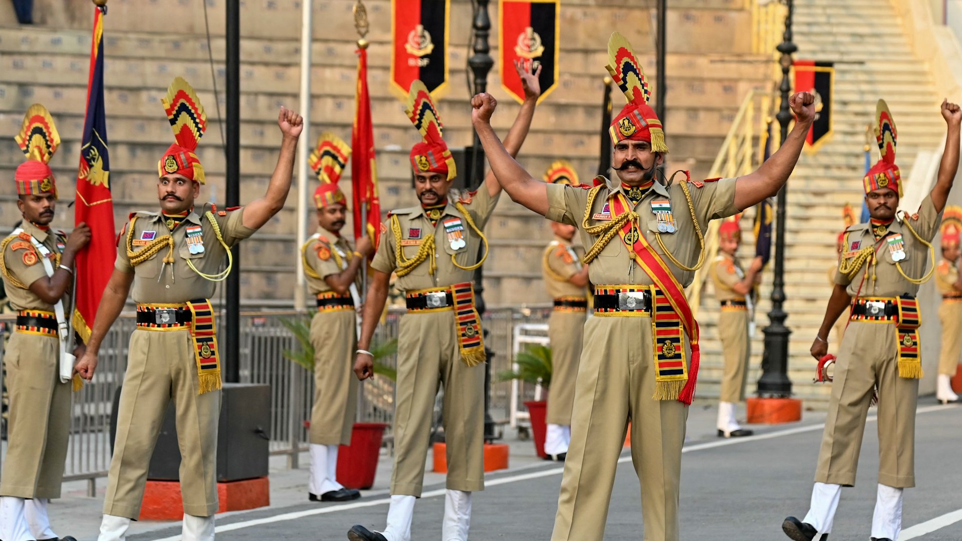 India and Pakistan to withdraw troops from contested region, resume border ceremony