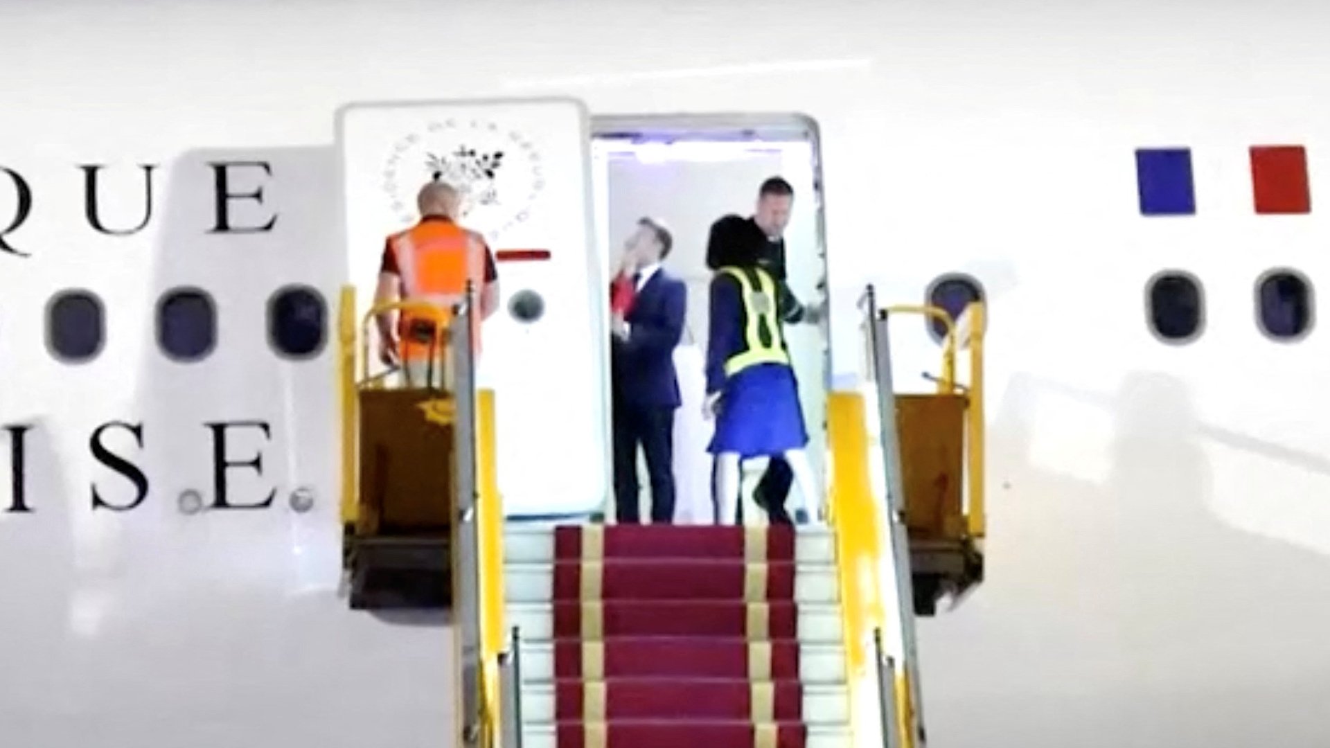 Macron appears to be pushed in the face by wife after landing in Vietnam