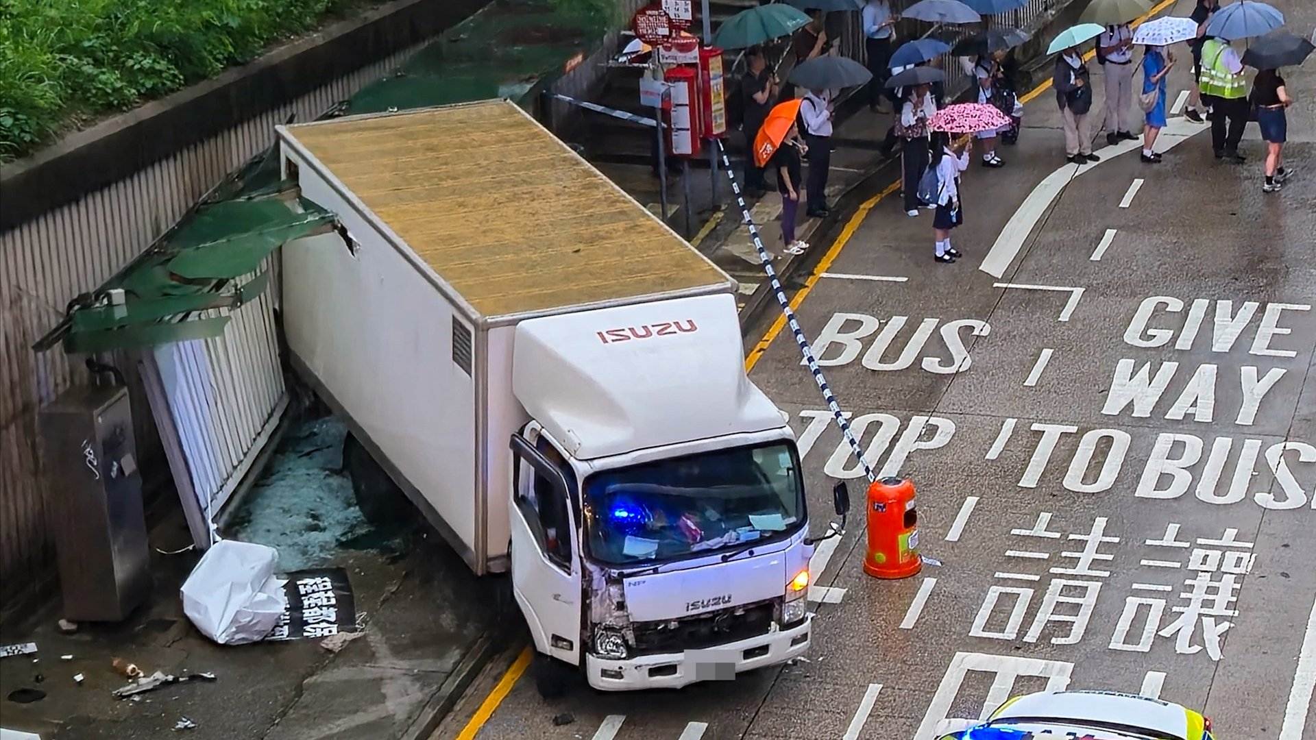 Hong Kong woman dies after being trapped under truck in bus stop crash