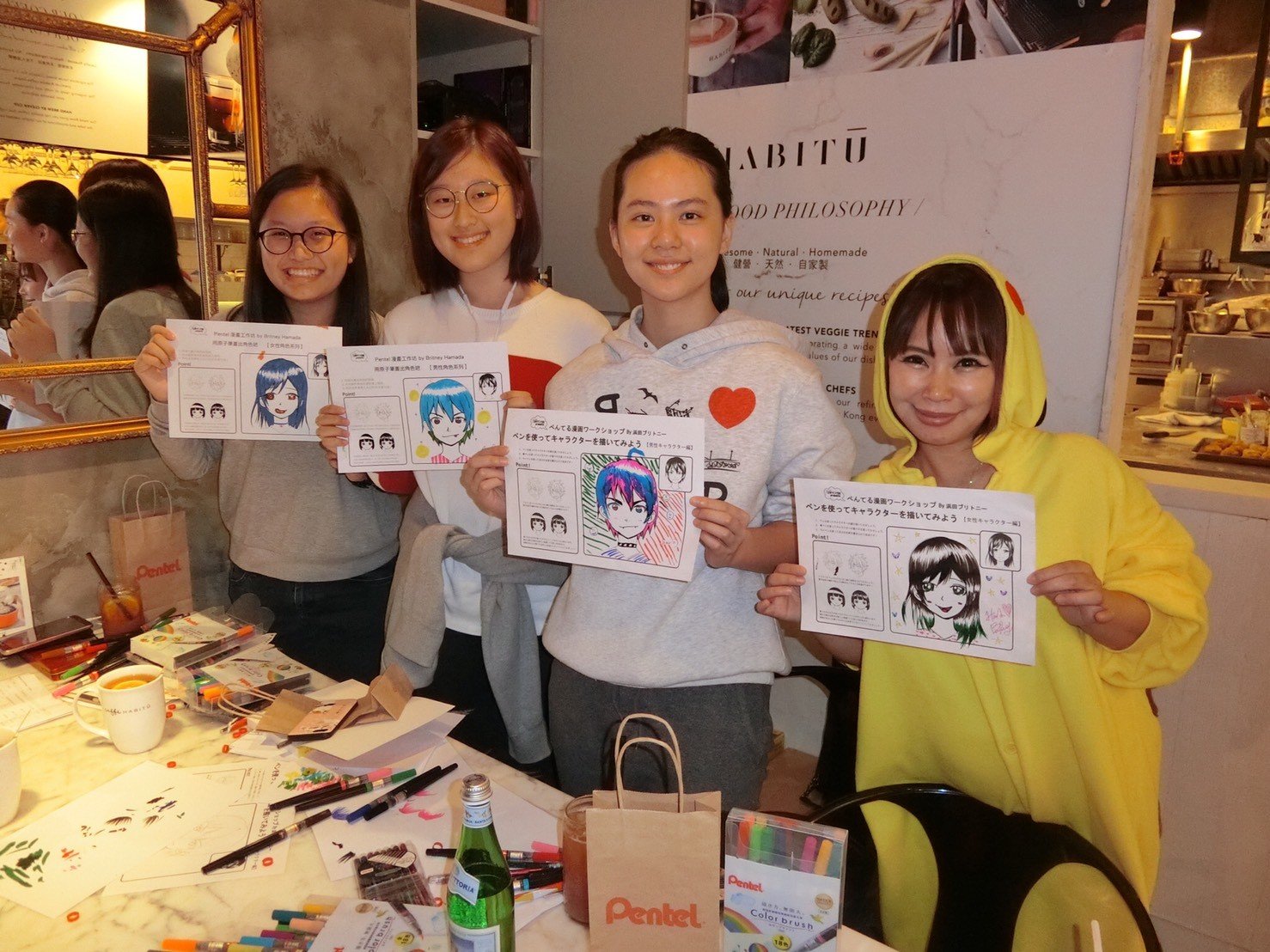 (From left) Junior Reporters Sherrie Mak, Jisoo Myung, Charlotte Fong, and cartoonist Britney Hamada.