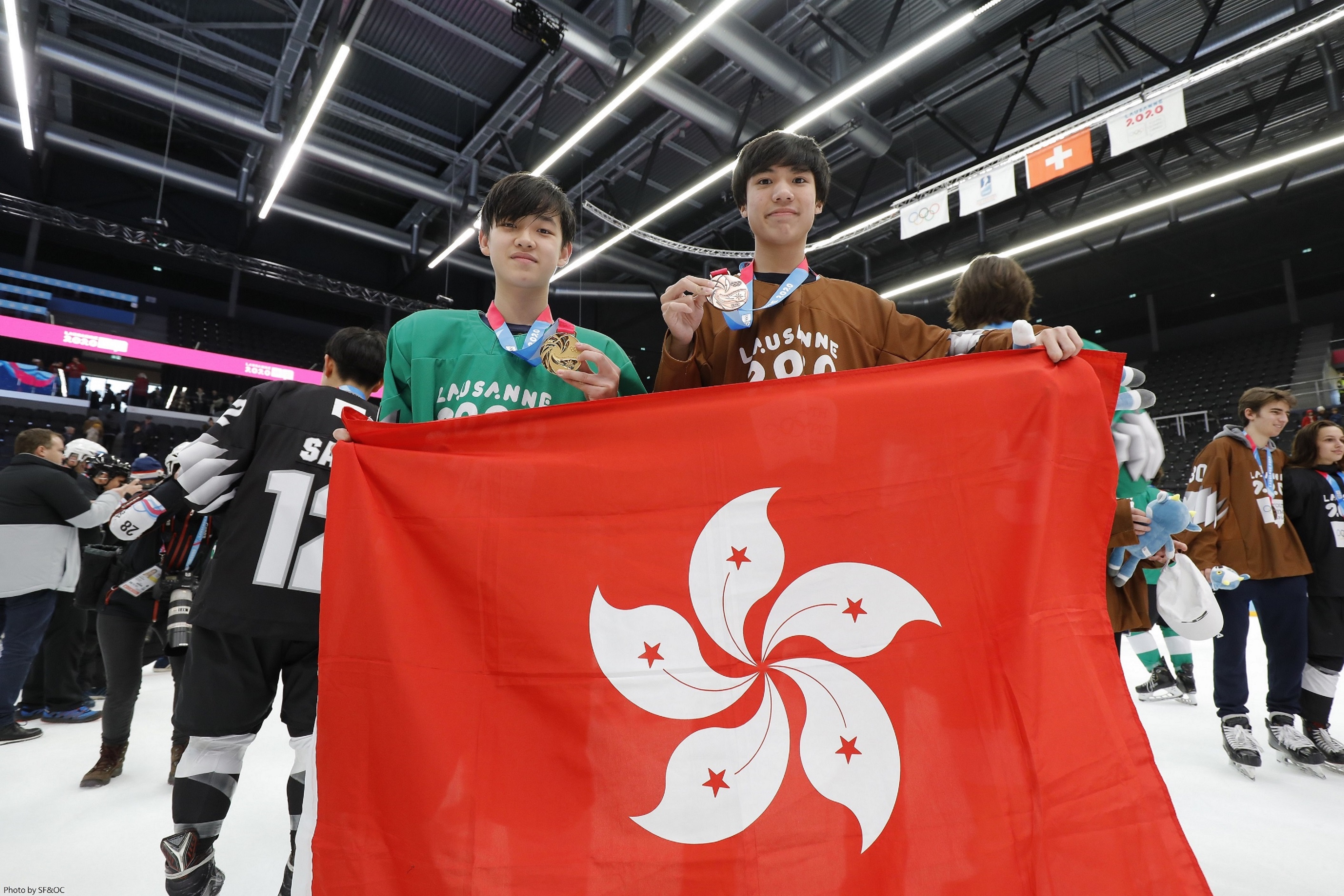 Yam Yau (left) and Elvis Hsu (right) made history for Hong Kong by clinching a gold and a bronze medal in the Men's Mixed NOC 3-on-3 event at the Winter Youth Olympics. 