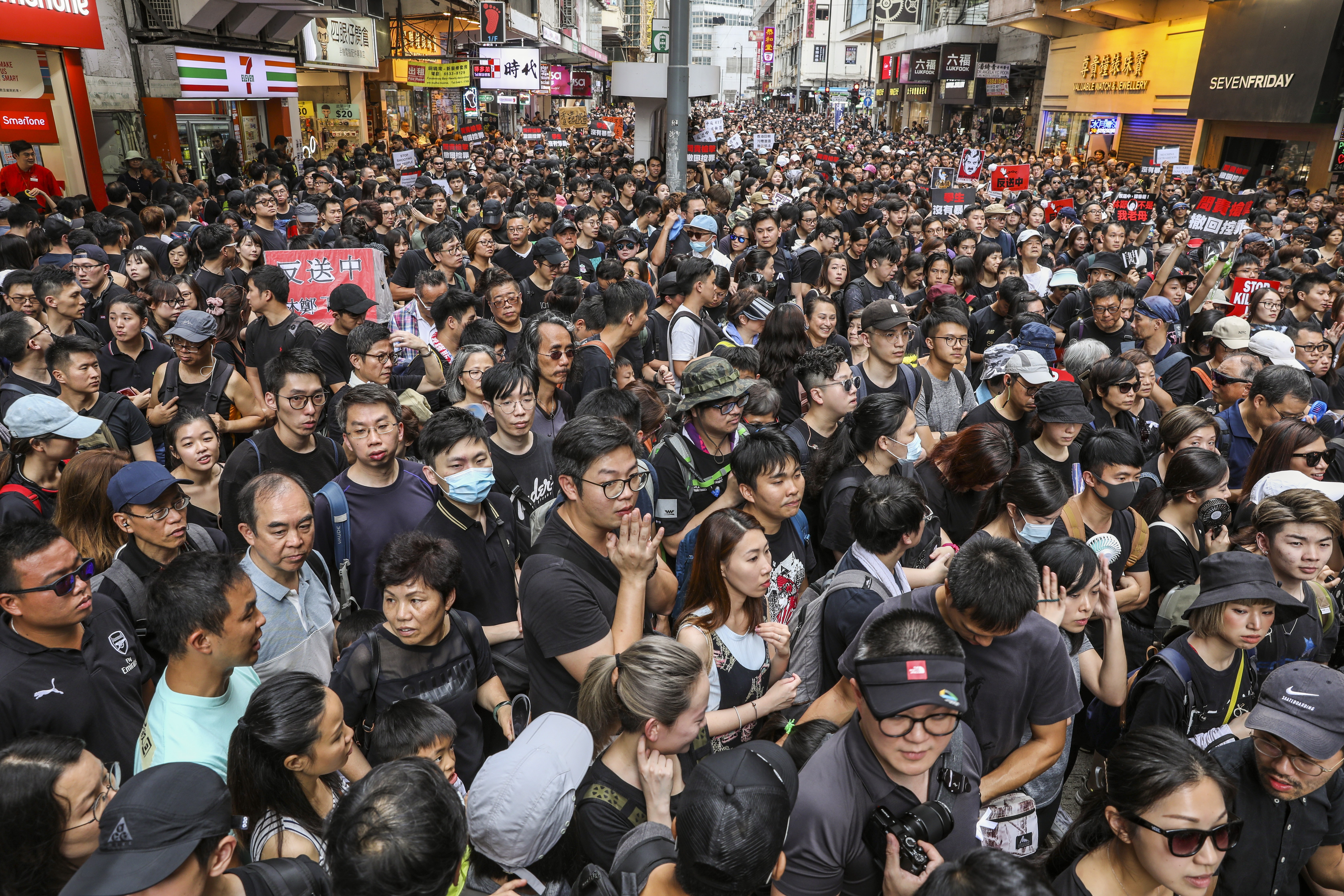 Protesters march from Causeway Bay to the Central Government Offices in Tamar against the extradition bill on June 16, 2019.
