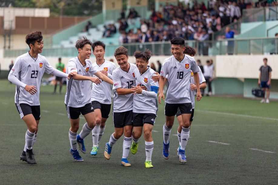 James Tang (second from right) celebrated his first goal for Diocesan Boys' School in the final with his teammates.
