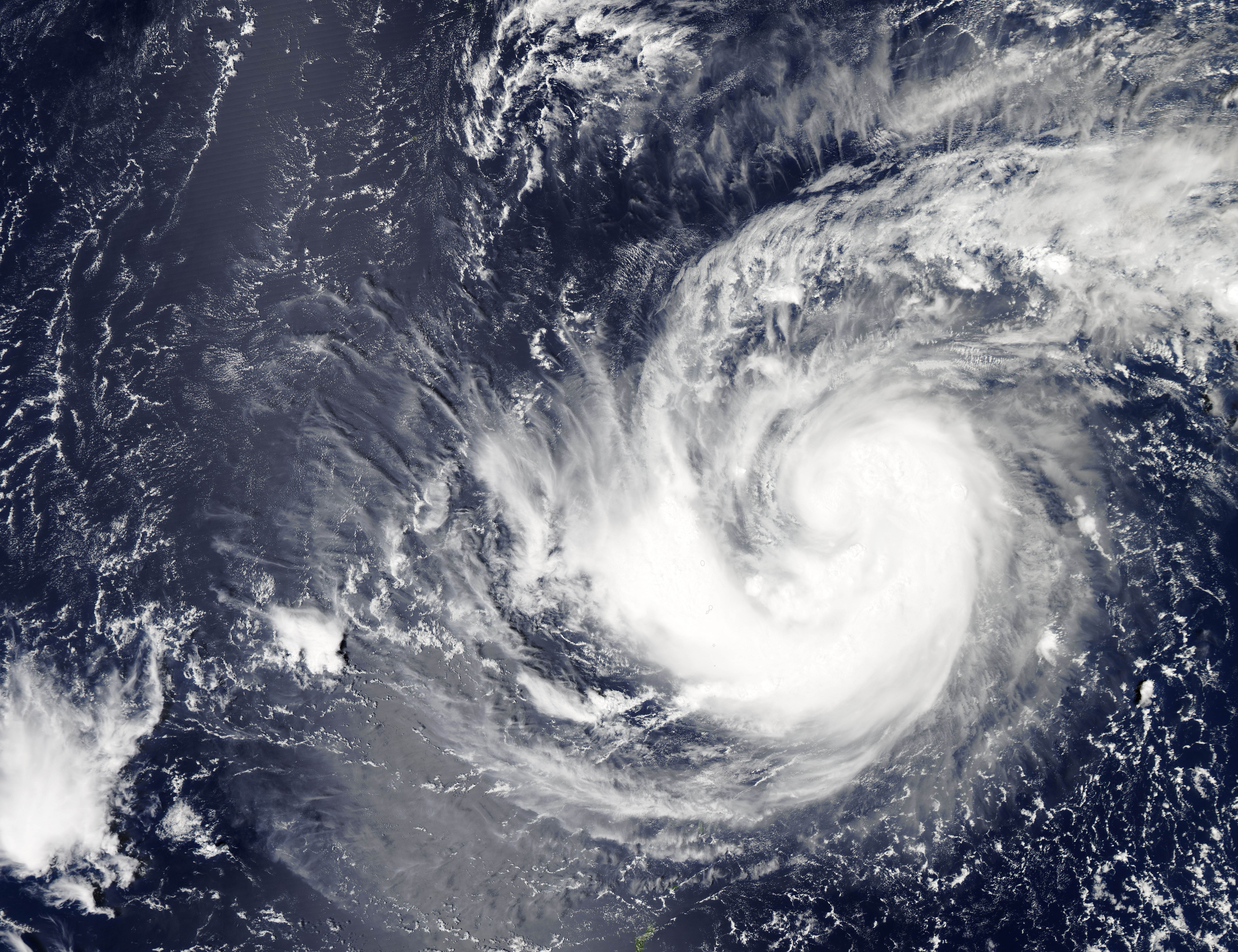 This September 16, 2015 NASA satellite image shows Tropical Storm Krovanh in the western Pacific Ocean. Late September 15 night, local time, then-Tropical Depression 20W strengthened into a tropical storm, with wind speeds gusting to 83 km/h (52 mph). 20W, which eventually was named Krovanh, was about 450 miles northeast of Guam. Even more strengthening is expected throughout the week, with Krovanh likely becoming a typhoon by September 17. Forecasters believe the storm will remain away from land. == RESTRICTED TO EDITORIAL USE / MANDATORY CREDIT: "AFP PHOTO / HANDOUT-NASA" NO MARKETING, NO ADVERTISING CAMPAIGNS, DISTRIBUTED AS A SERVICE TO CLIENTS ==