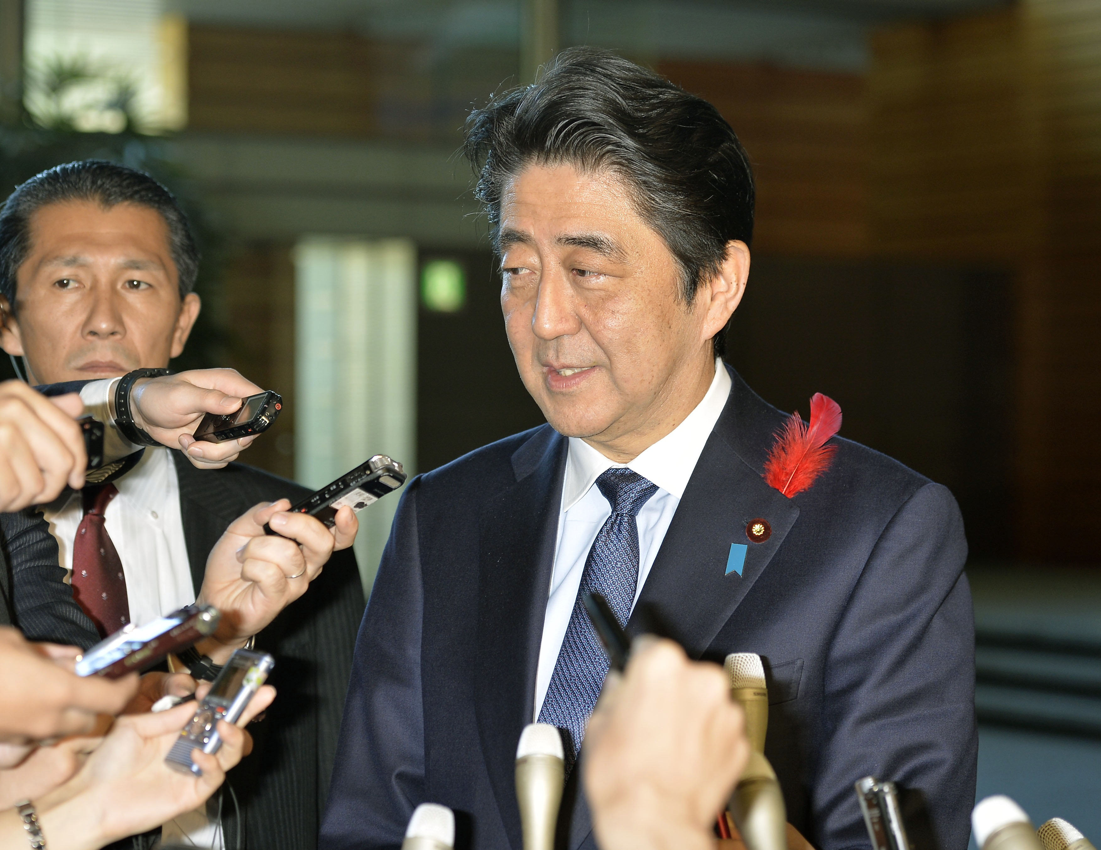 Japanese Prime Minister Shinzo Abe meets with reporters at his office in Tokyo on Oct. 8, 2015, following the launch the previous day of a reshuffled Cabinet. (Kyodo) ==Kyodo