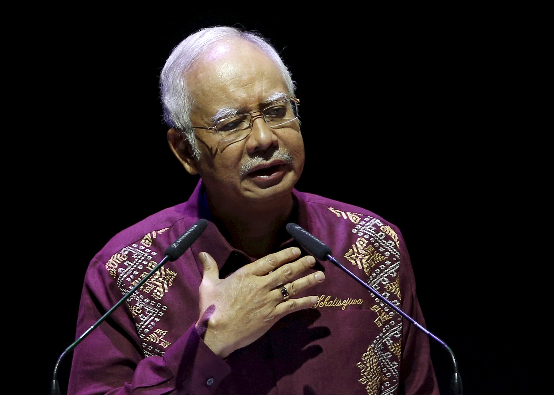 Malaysia's Prime Minister Najib Razak addresses the nation in a National Day message in the capital city of Kuala Lumpur in this August 30, 2015 file photo. Malaysia's Prime Minister Najib Razak faces the toughest test of his political career so far when parliament reconvenes next week, with the leader facing questions from a growing number of establishment figures about his alleged role in a graft scandal at the state investment fund. REUTERS/Edgar Su/Files