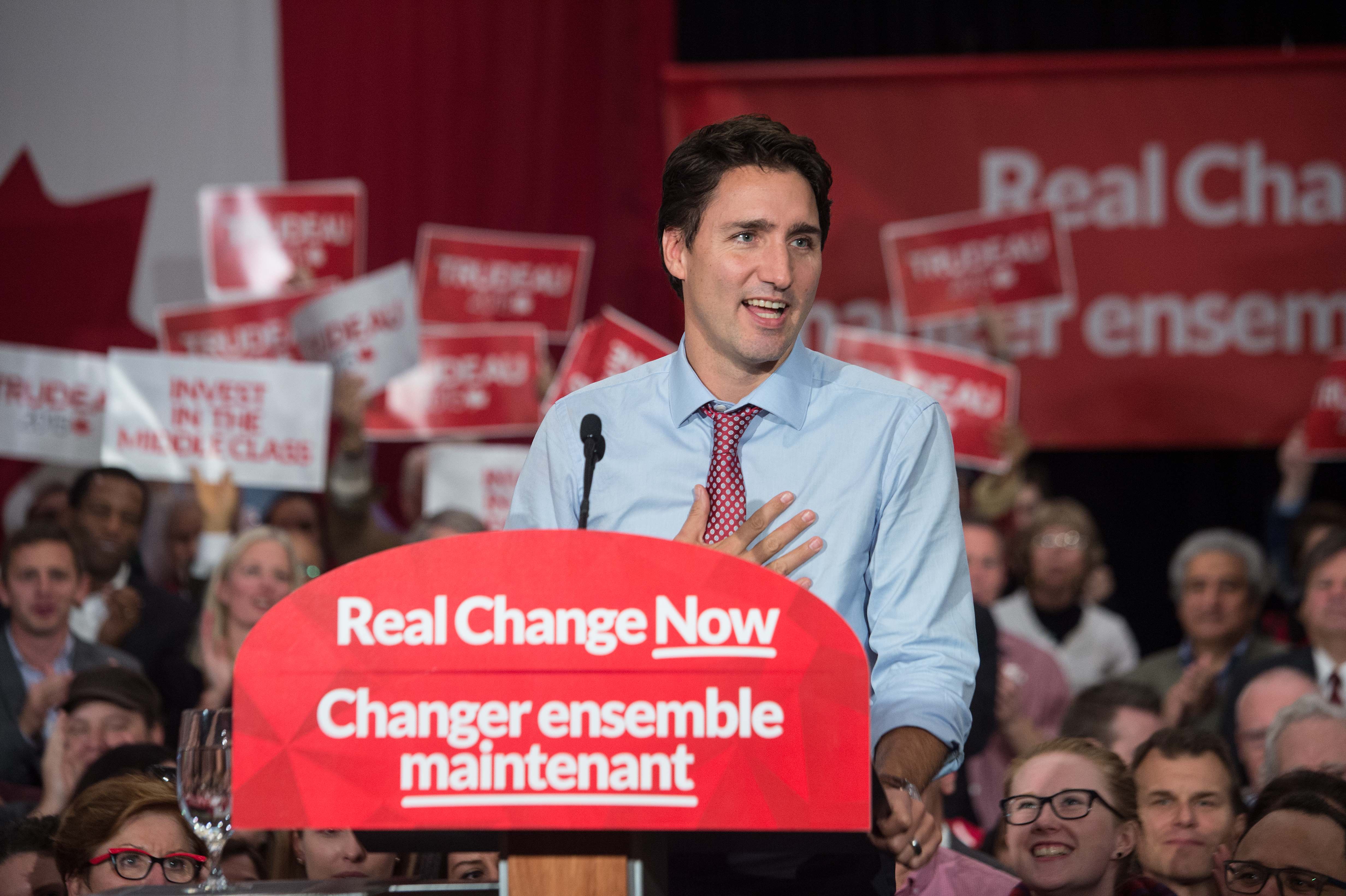 Canadian Liberal Party leader Justin Trudeau speaks at a victory rally in Ottawa on October 20, 2015 after winning the general elections. Liberal leader Justin Trudeau reached out to Canada's traditional allies after winning a landslide election mandate to change tack on global warming and return to the multilateralism sometimes shunned by his predecessor. AFP PHOTO/ NICHOLAS KAMM