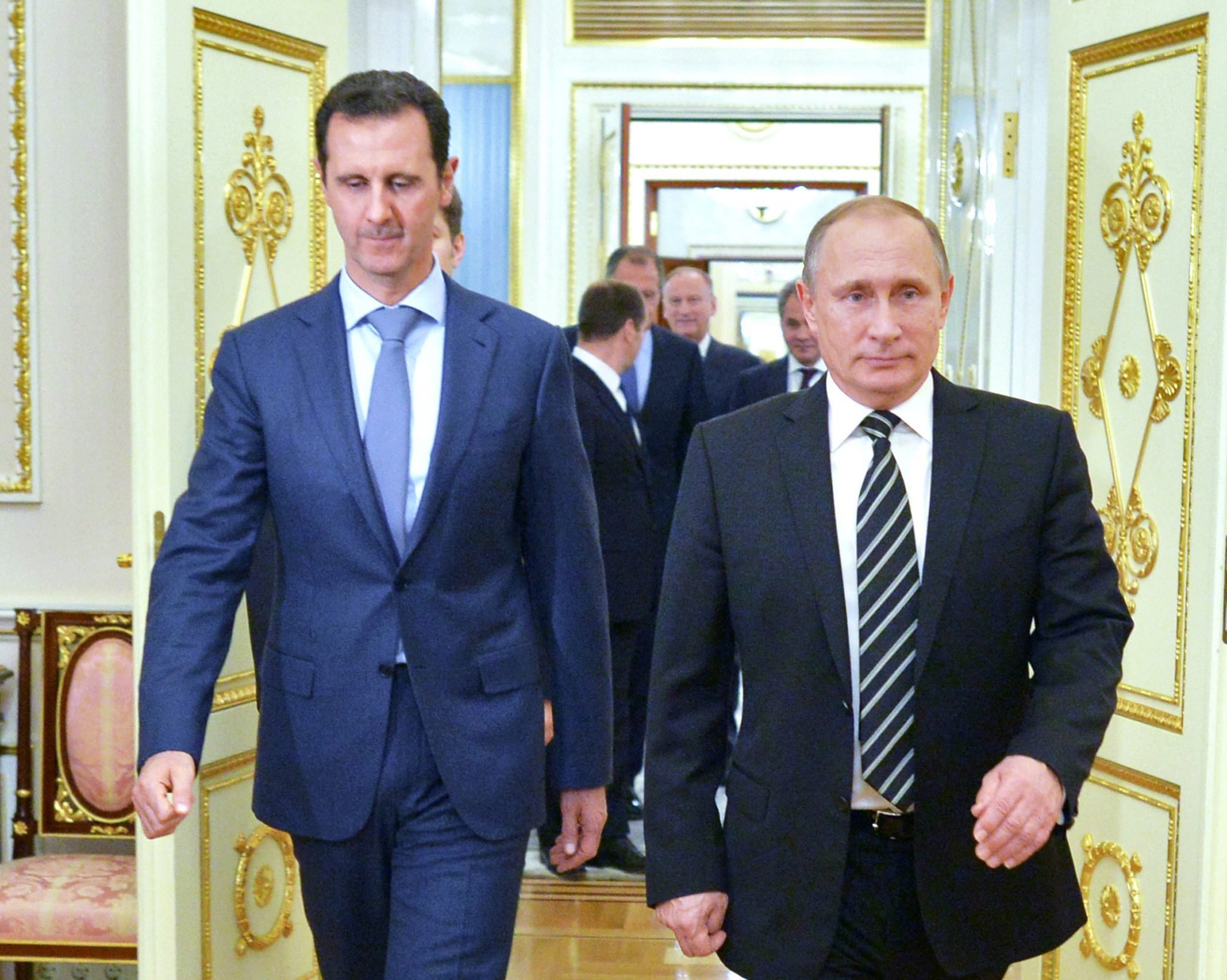 epa04986383 A picture made available on 21 October 2015 shows Russian President Vladimir Putin (R) and Syrian President Bashar al-Assad entering a hall during their meeting at the Kremlin in Moscow, Russia, 20 October 2015. Beleaguered Syrian President Bashar al-Assad travelled to Moscow for talks with his Russian counterpart Vladimir Putin, the Kremlin revealed on 21 October 2015. Assad and Putin discussed the situation in war-torn Syria on 20 October 2015 evening during the talks that had not been made public in advance, the Kremlin spokesman said. The talks dealt with the 'fight against terrorist extremist groups' and with Russian air support for attacks by Syrian troops on the ground. Russia has been carrying out airstrikes in Syria since the end of September. Moscow has declared the so-called Islamic State (IS or ISIS) as the main enemy, but Western nations have accused Moscow of attacking other groups opposed to the Assad regime. EPA/ALEXEY DRUZHINYN/RIA NOVOSTI/POOL ALTERNATIVE 