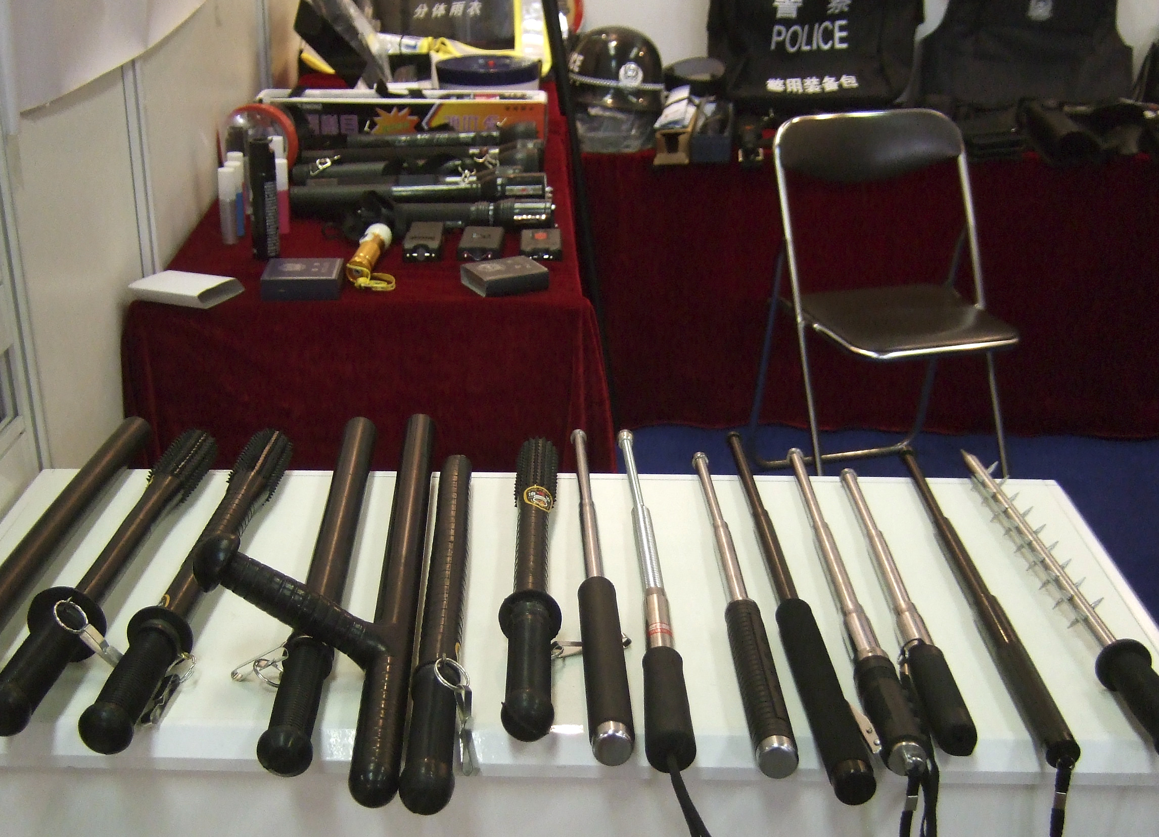 In this undated photo supplied by Amnesty International, side handled and telescopic batons and spike batons are displayed at a police equipment exhibition, at an undisclosed location. Chinese production and export of police equipment primarily used for torture, such as electric shock wands and neck-and-wrist cuffs connected by a chain, has grown dramatically, enabling human rights violations at home and abroad, Amnesty International said in a report Tuesday, Sept. 23, 2014. (AP Photo/Amnesty International)