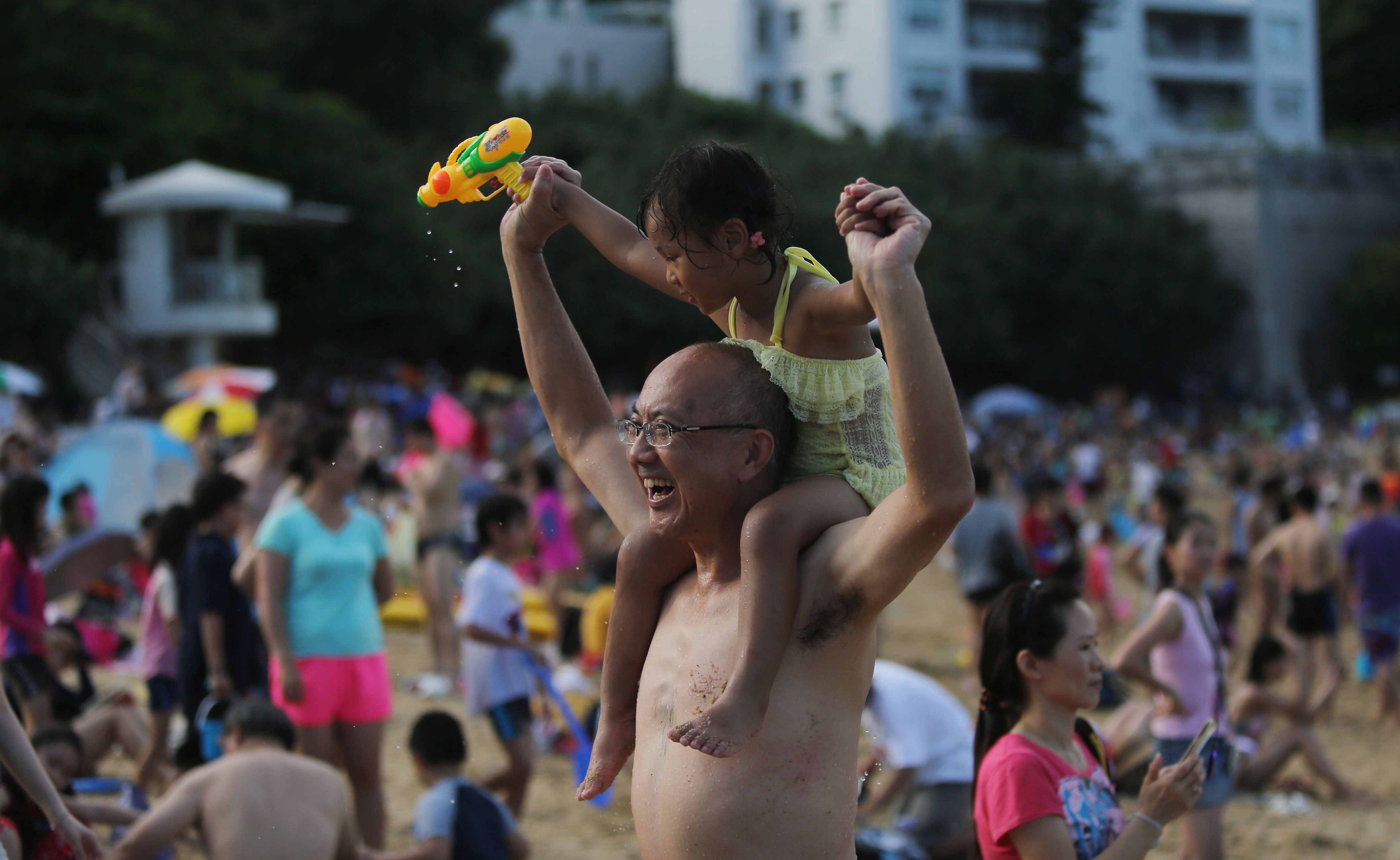 Swimmers relax on the Stanley Main Beach while Very Hot Weather Warning has been issued by the Hong Kong Observatory. 20JUN15