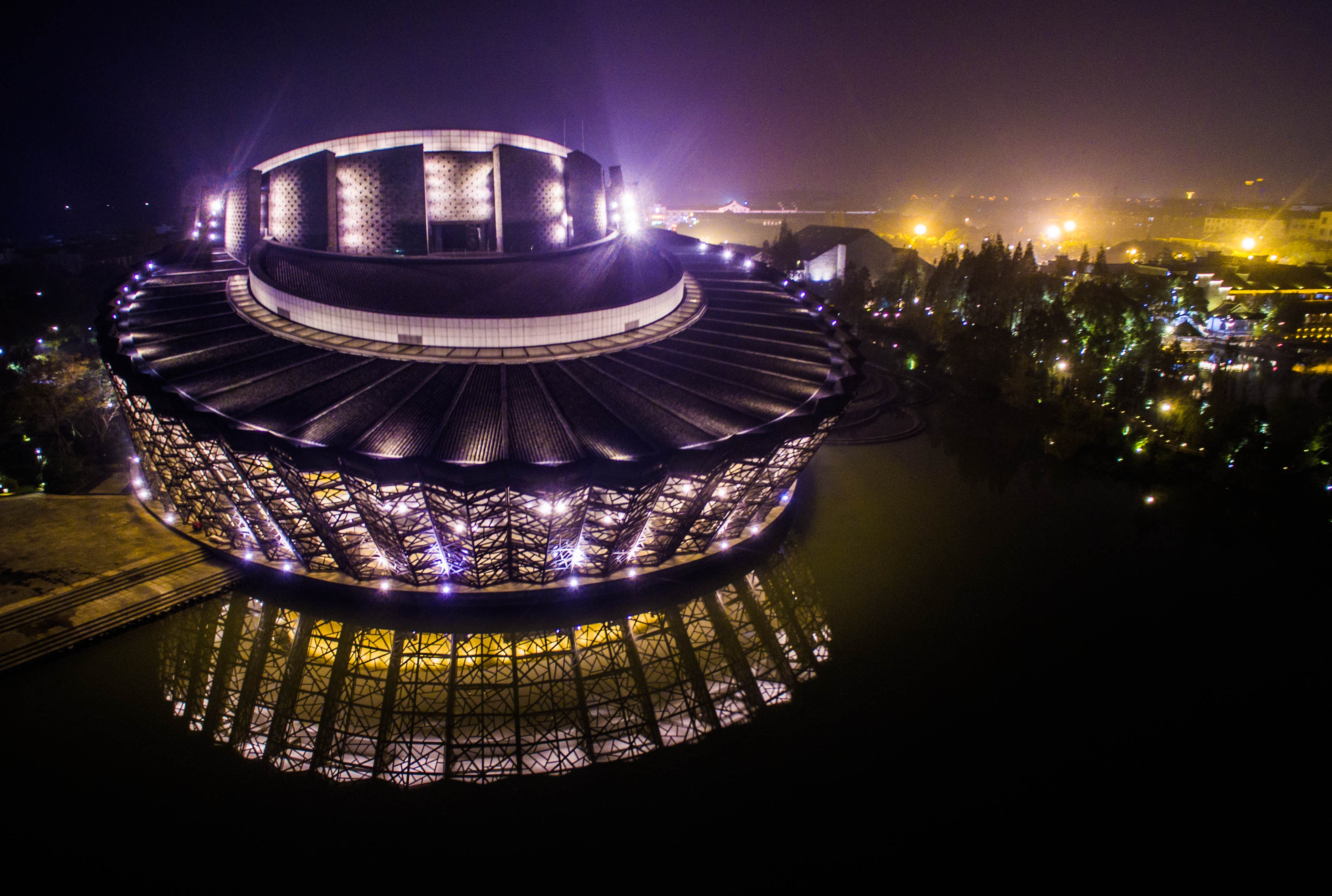 (151209) -- WUZHEN, Dec. 9, 2015 (Xinhua) -- An aerial photo taken on Dec. 7, 2015 shows the night view of an opera house in Wuzhen Township, a host town for the World Internet Conference, east China's Zhejiang Province. The World Internet Conference will be held in Wuzhen from Dec. 16 to 18. (Xinhua/Xu Yu) (lfj)