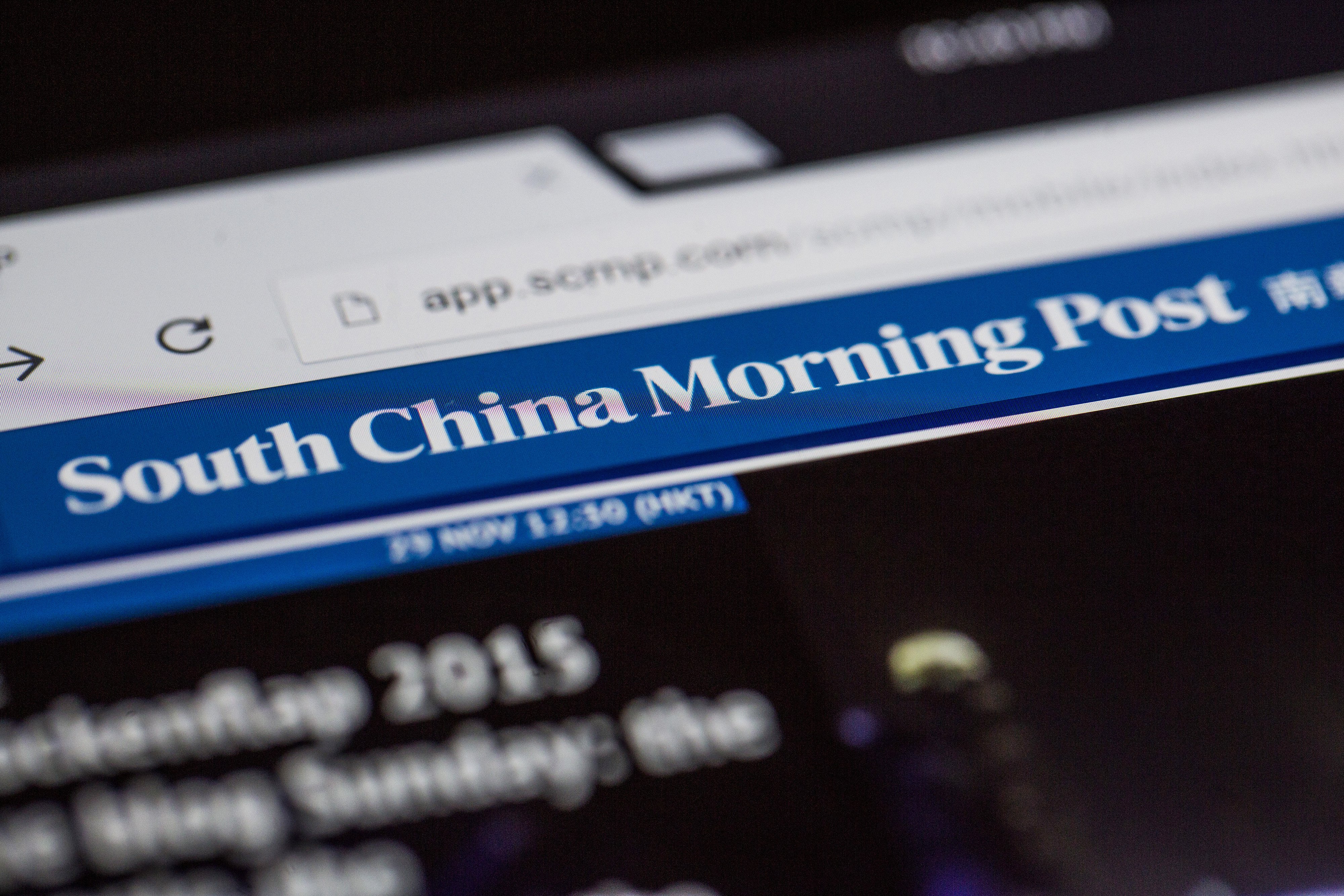 The South China Morning Post (SCMP) app is arranged for a photograph on a tablet in Hong Kong, China, on Sunday, Nov. 29, 2015. Alibaba Group Holding Ltd.'s founder Jack Ma is in talks to buy a stake in the publisher of Hong Kong's South China Morning Post, according to people familiar with the matter, in what could make him the latest Internet-industry tycoon to pursue the revival of a traditional newspaper. Photographer: Justin Chin/Bloomberg ORG XMIT: 594105521
