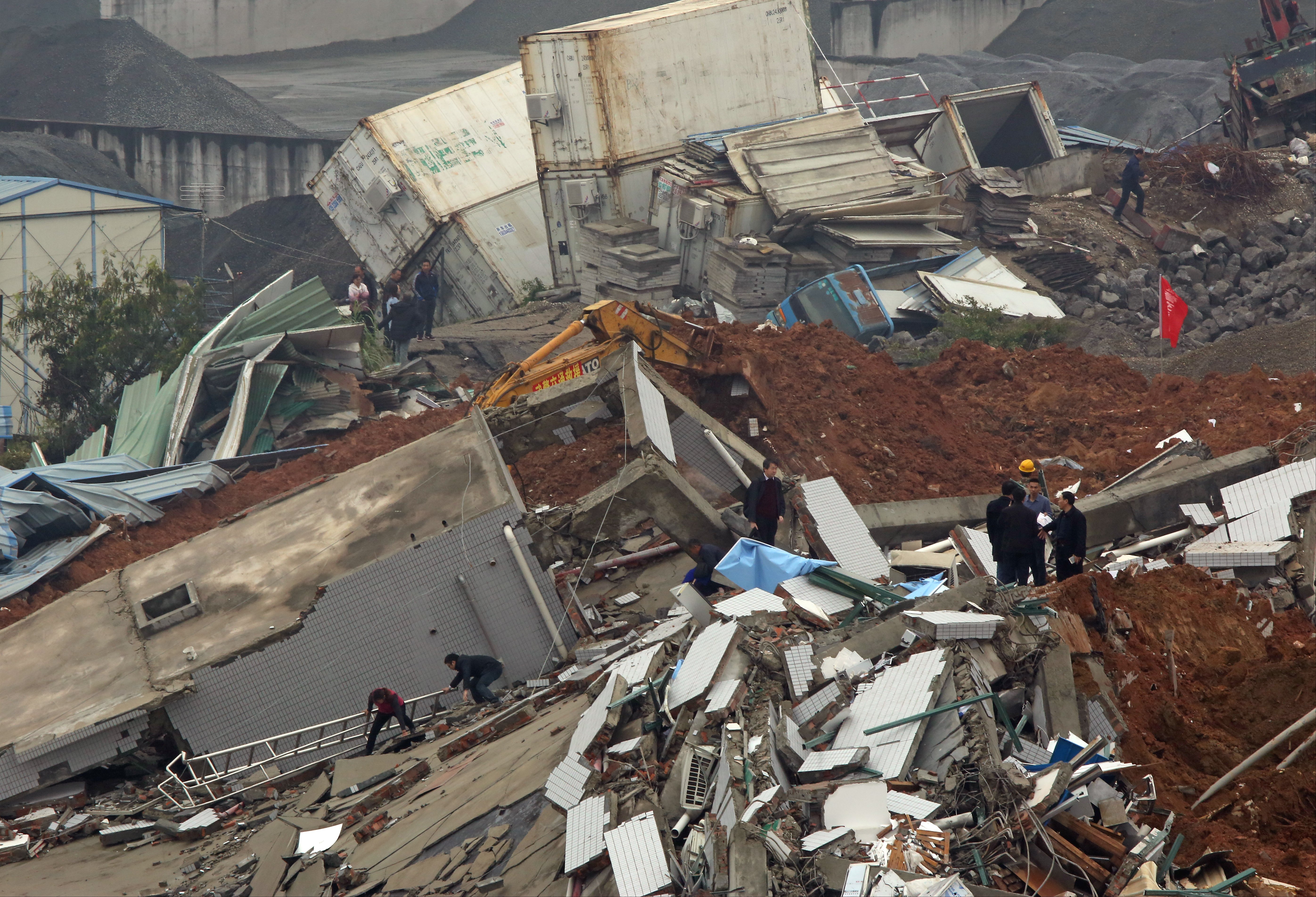 Collapsed buildings are seen at the landslide site at Hengtaiyu industrial park in Shenzhen. 21DEC15 SCMP/Edward Wong