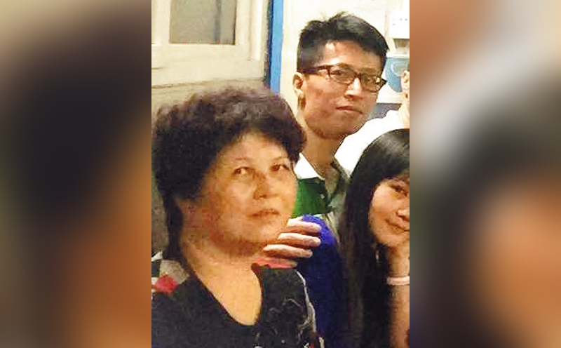 Peng's mother (left) and his elder brother.