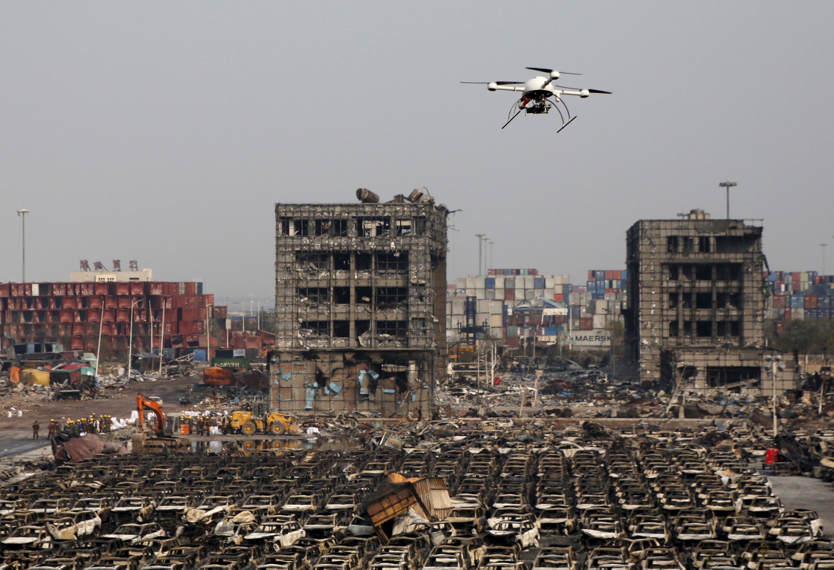REFILE - CAPION CLARIFICATION A drone operated by paramilitary police flies over the site of August 12, 2015 explosions at Binhai new district in Tianjin, China, in this August 17, 2015 file photo. Chinese drone developers are racking up an impressive list of aerial solutions for a growing variety of demands, from police surveillance to agricultural mapping and traffic management. Already well established as a world leader in drone manufacturing, China is slowly emerging as a world-class innovator, not just a duplicator of foreign designs. REUTERS/Kim Kyung-Hoon/Files