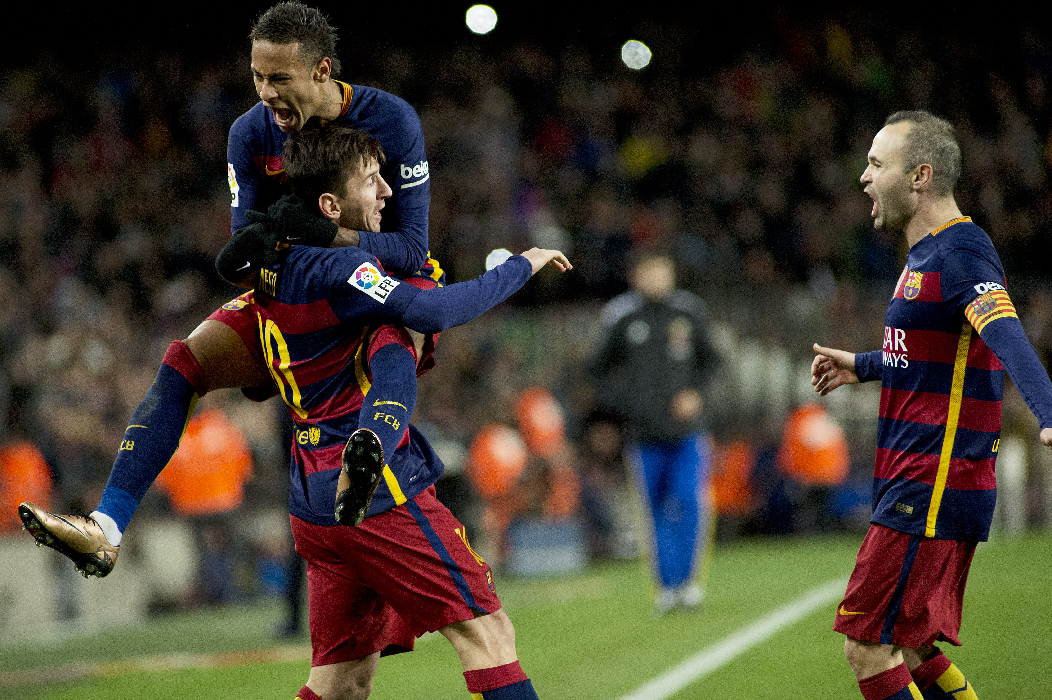 (160107) -- BARCELONA, Jan. 7, 2016 (Xinhua) -- FC Barcelona's Argentinian forward Lionel Messi (Bottom L) celebrates after scoring with FC Barcelona's Neymar and Iniesta during Spanish King's Cup eighth final match first round between FC Barcelona and RCD Espanyol at the Camp Nou stadium in Barcelona, Spain, on Jan. 6, 2016. FC Barcelona won 4-1. (Xinhua/Lino De Vallier)