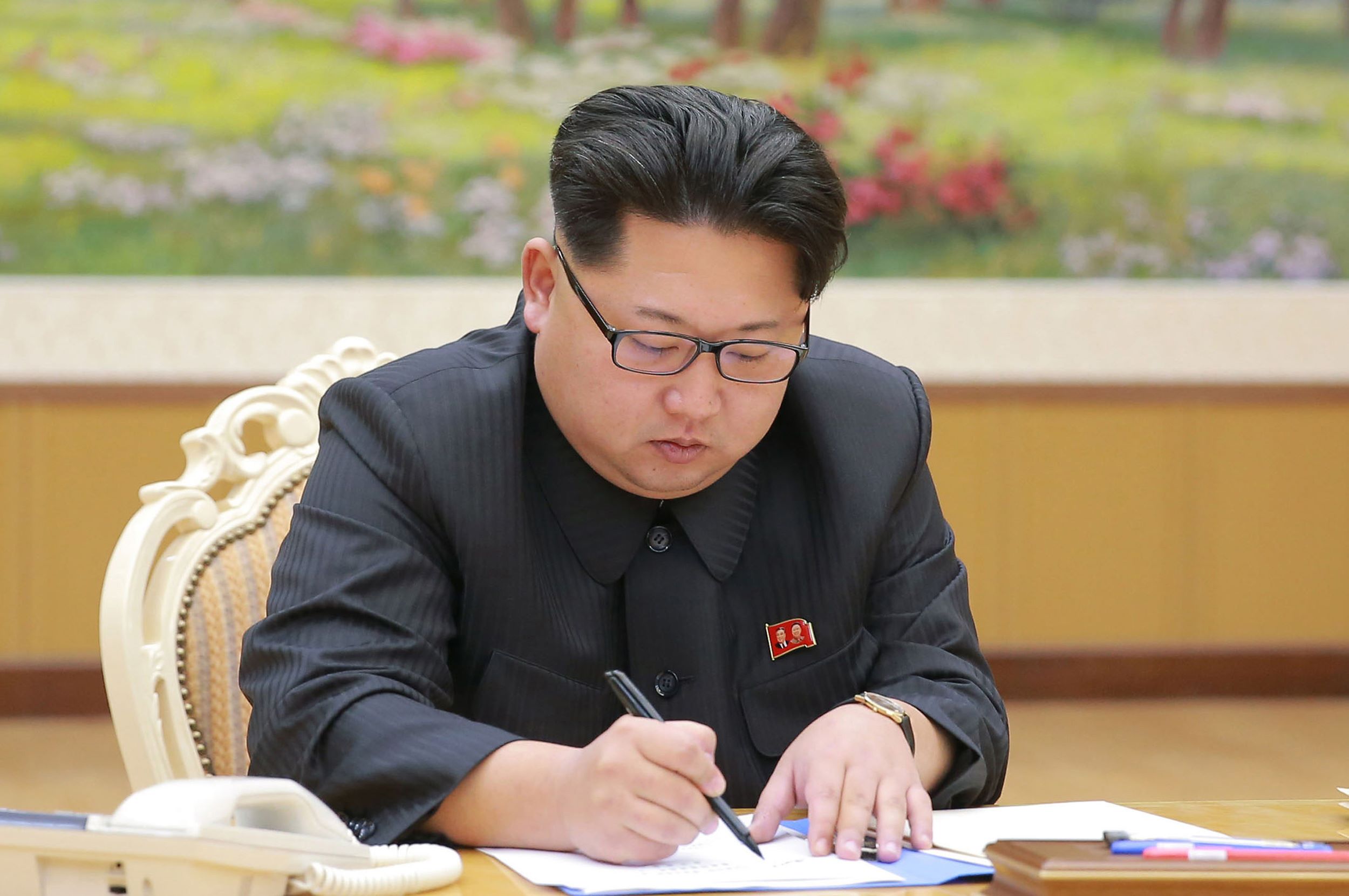 This picture taken by North Korea's official Korean Central News Agency (KCNA) on January 3, 2016 and released on January 7 shows North Korean leader Kim Jong-Un signing a document for a hydrogen bomb test in Pyongyang. North Korea announced on January 6 it had successfully carried out its first hydrogen bomb test, a development that, if confirmed, would marking a stunning step forward in its nuclear development. AFP PHOTO / KCNA via KNS REPUBLIC OF KOREA OUT THIS PICTURE WAS MADE AVAILABLE BY A THIRD PARTY. AFP CAN NOT INDEPENDENTLY VERIFY THE AUTHENTICITY, LOCATION, DATE AND CONTENT OF THIS IMAGE. THIS PHOTO IS DISTRIBUTED EXACTLY AS RECEIVED BY AFP. ---EDITORS NOTE--- RESTRICTED TO EDITORIAL USE - MANDATORY CREDIT "AFP PHOTO / KCNA VIA KNS" - NO MARKETING NO ADVERTISING CAMPAIGNS - DISTRIBUTED AS A SERVICE TO CLIENTS