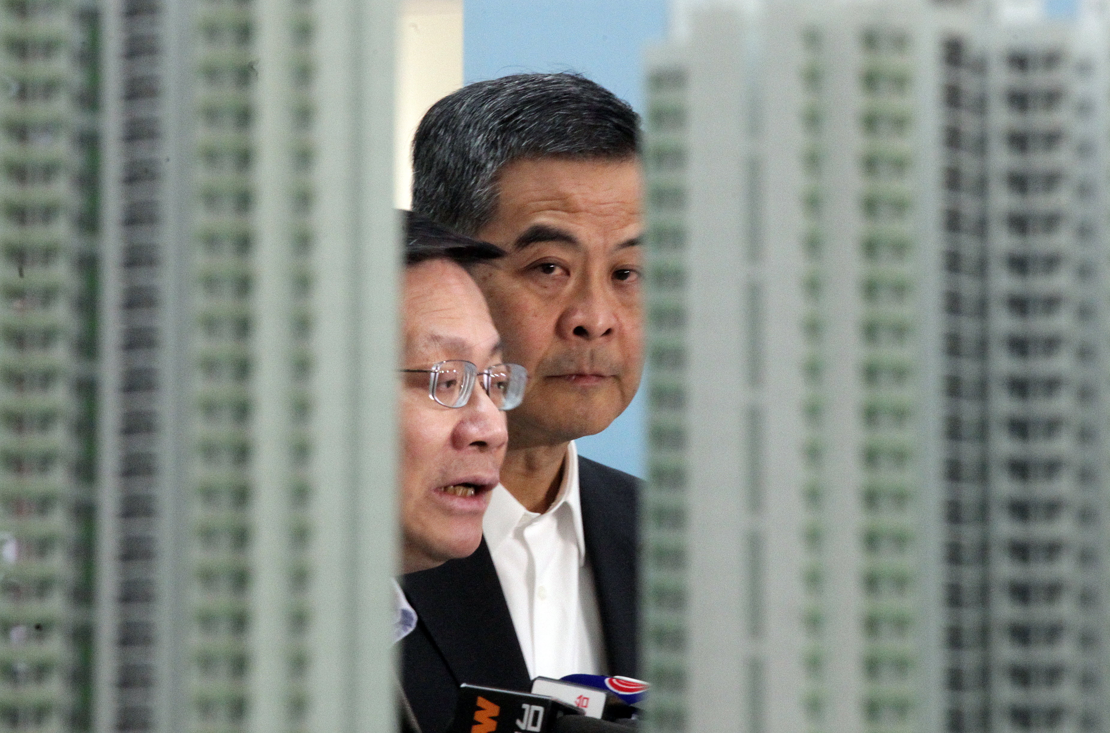 (L to R) Secretary for Transport and Housing Anthony Cheung Bing-leung and Chief Executive Leung Chun-ying, attends a press conference on Home Ownership Scheme (HOS) demonstration unit at Domain Mall in Yau Tong. 22DEC14