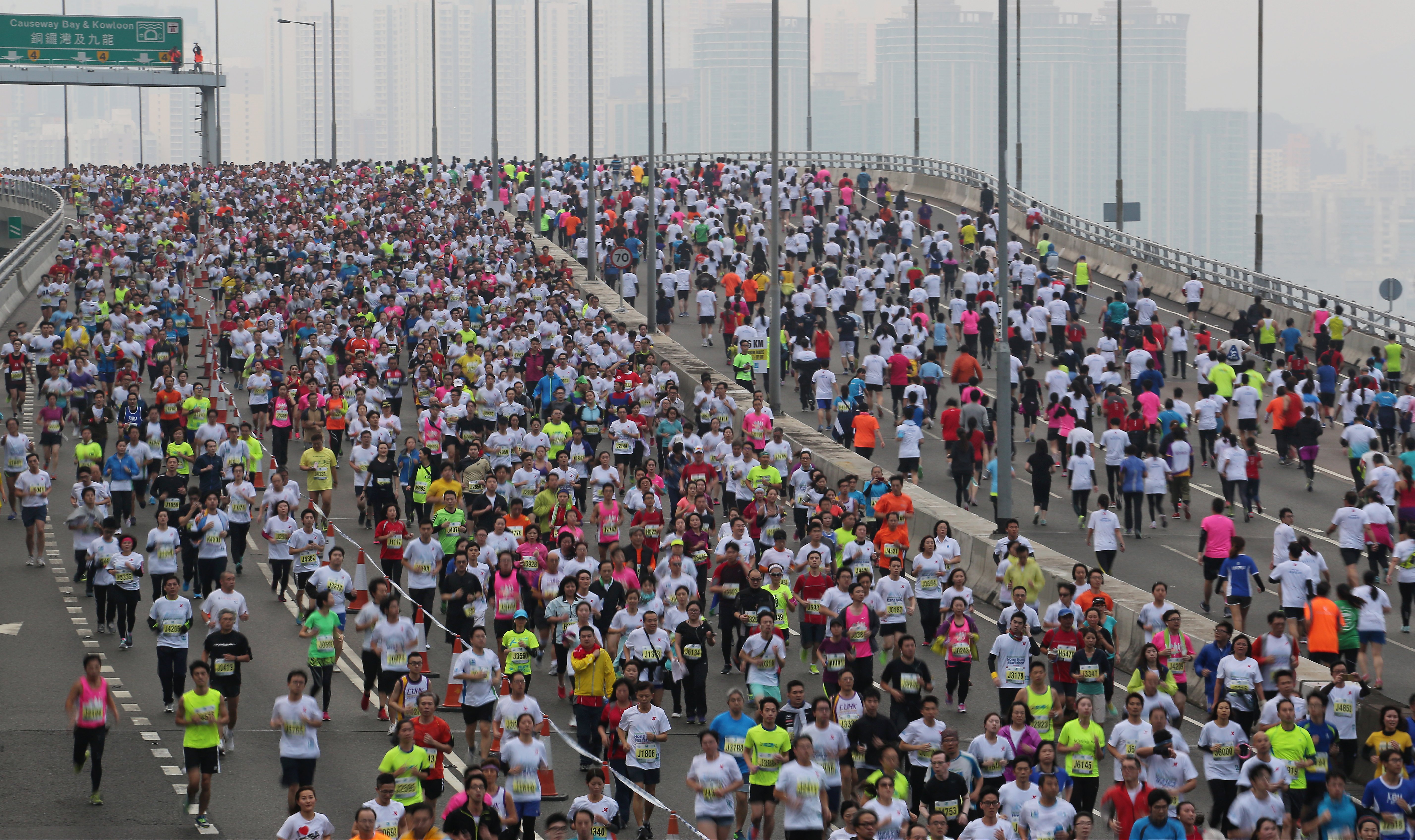Participants compete at Island Eastern Corridor during Standard Chartered Hong Kong 2015 Marathon. 25JAN15