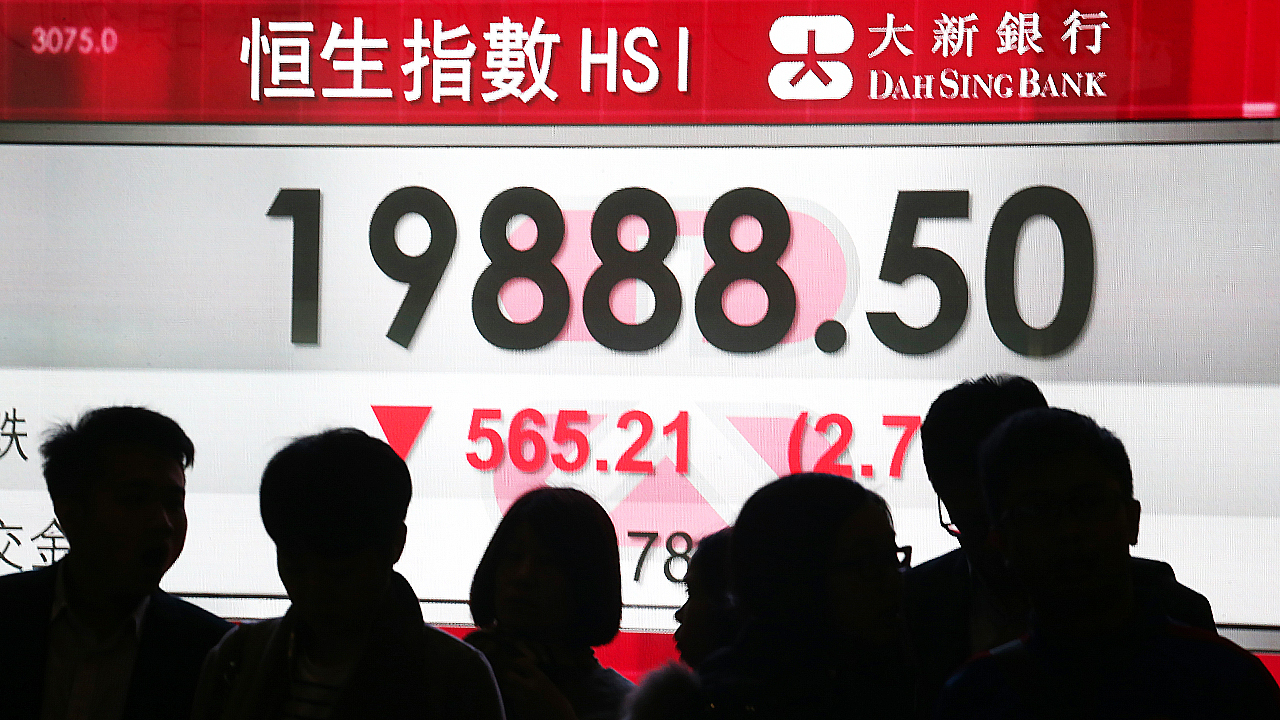 A chart on an electronic stock board shows the Hang Seng index (HSI) in Central. The benchmark Hang Seng index goes down 2.7 percent to close at 19,888.5. 11JAN16 SCMP/ Felix Wong