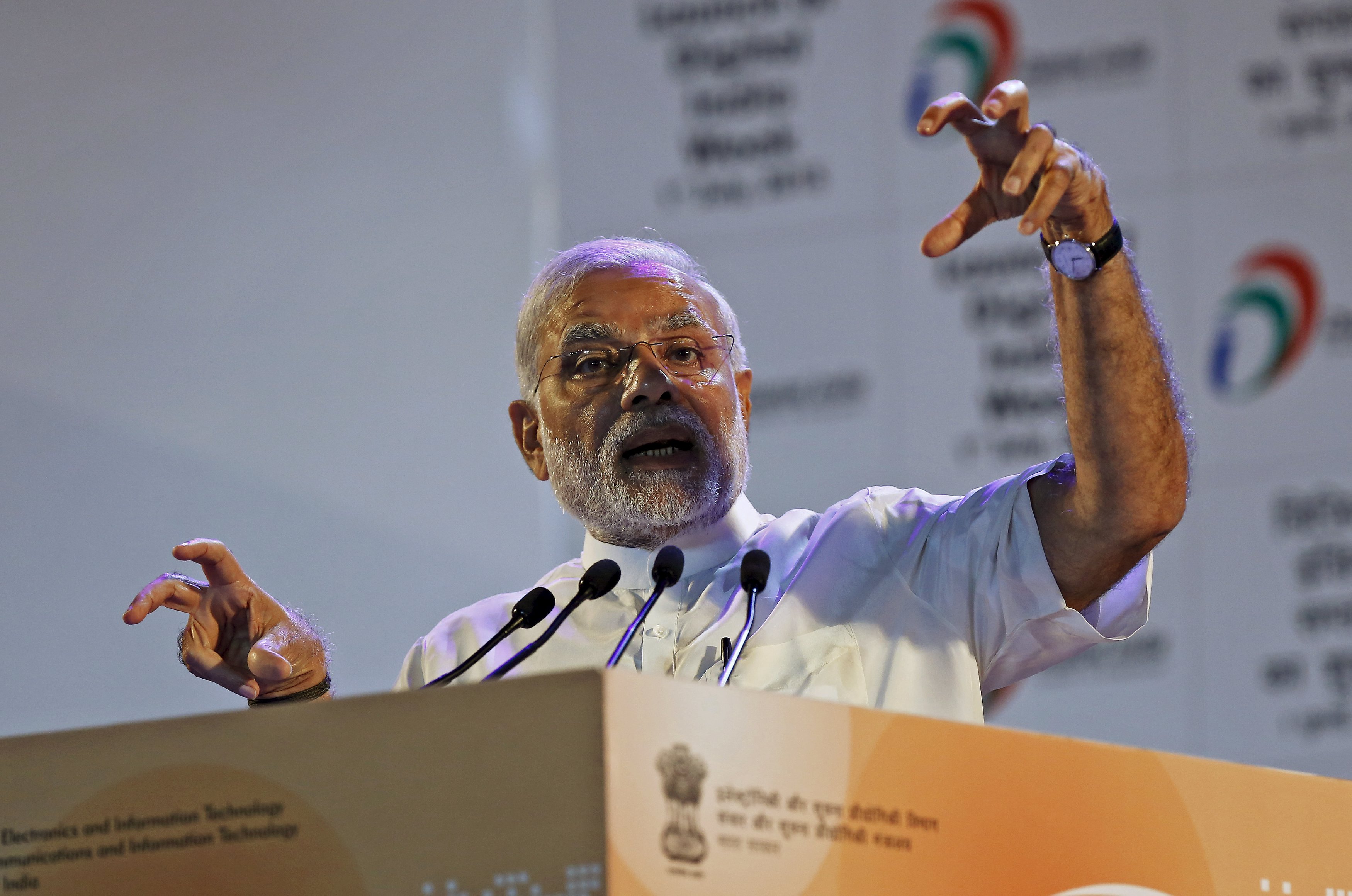 Indian Prime Minister Narendra Modi gestures while addressing the gathering during the launch of "Digital India Week" in New Delhi, India, July 1, 2015. Modi urged more companies to make electronic and digital goods on Wednesday, reviving his campaign promise to bridge India's digital divide backed by over $70 billion in investment pledges. REUTERS/Adnan Abidi