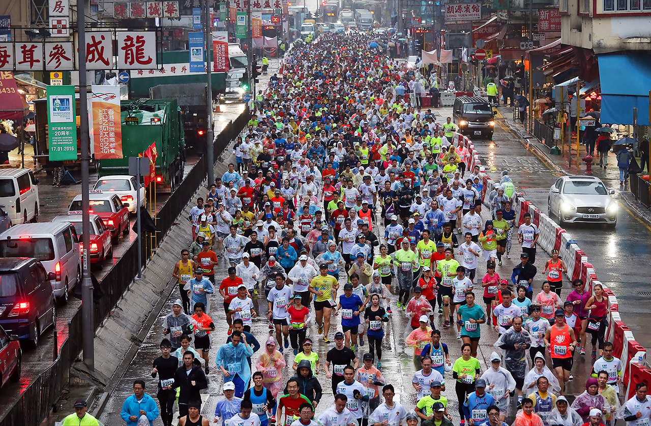 Runners passing through the Nathan Road in Mong Kok at the Hong Kong Marathon 2016. 17JAN16 SCMP/ Dickson Lee