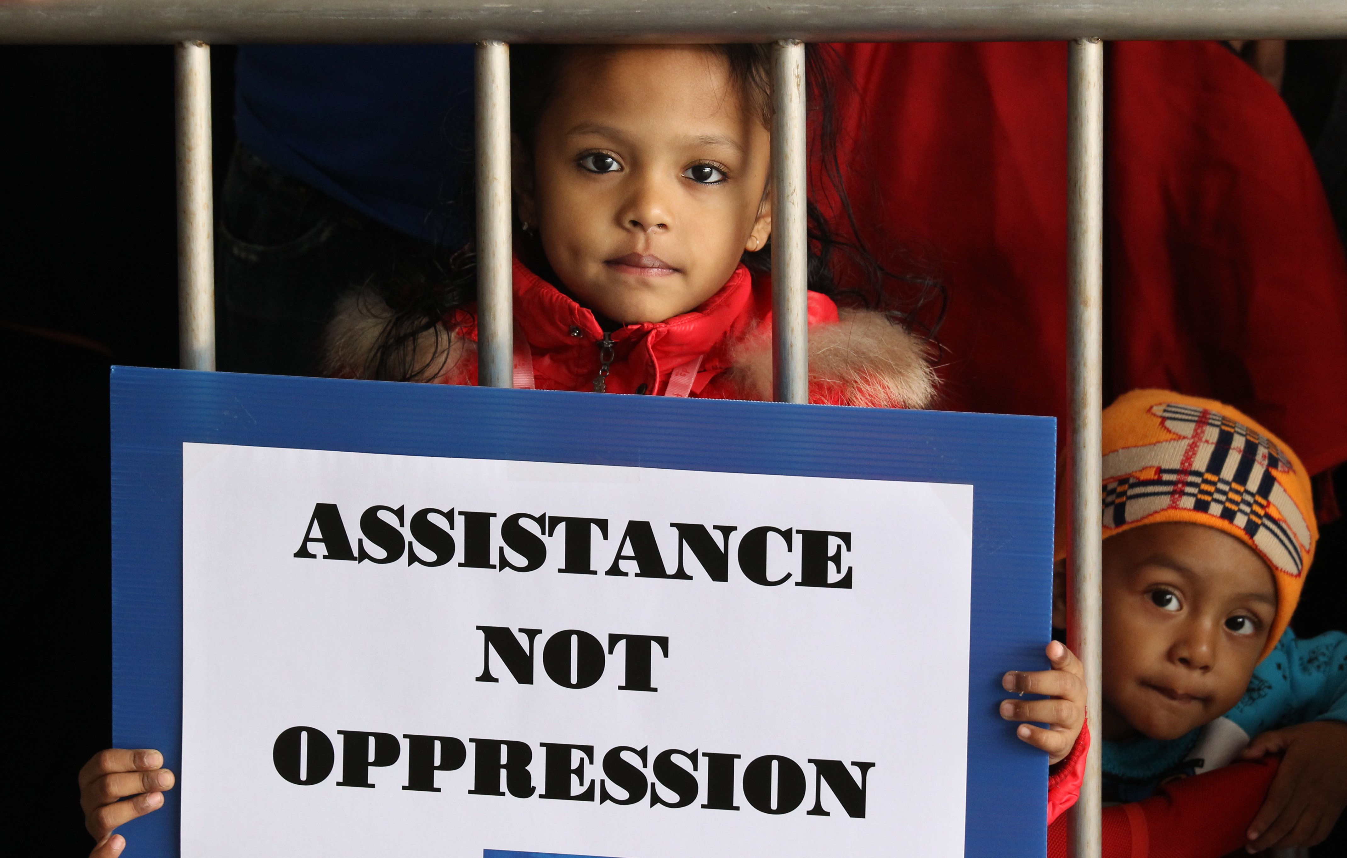 Nikhila Zara Begum, 4 years old and Rauf Muqsith, 2 years old protest with about 100 asylum seekers and refugees appeal to Legislative Council Social Welfare panel over improvement in screening mechanism; Legco Complex, Tamar. 13Jan14.