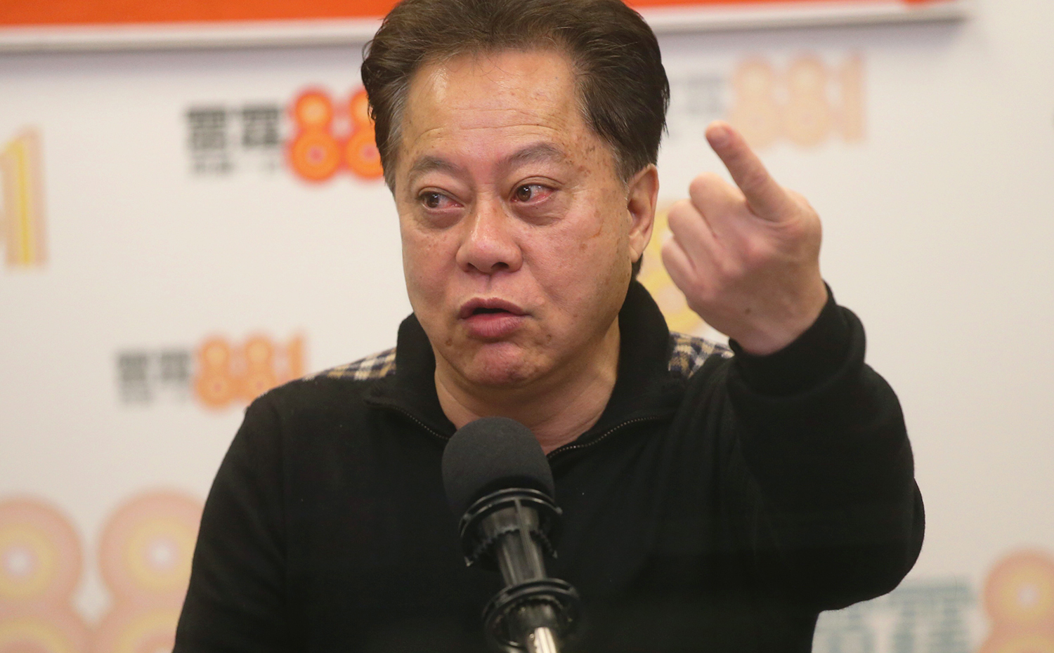 Chairman of Sheung Shui Rural Committee Hau Chi-keung attends Commercial Radio programme and talks about rural gentries forming own political party and NT small house privilege.SCMP/K. Y. Cheng