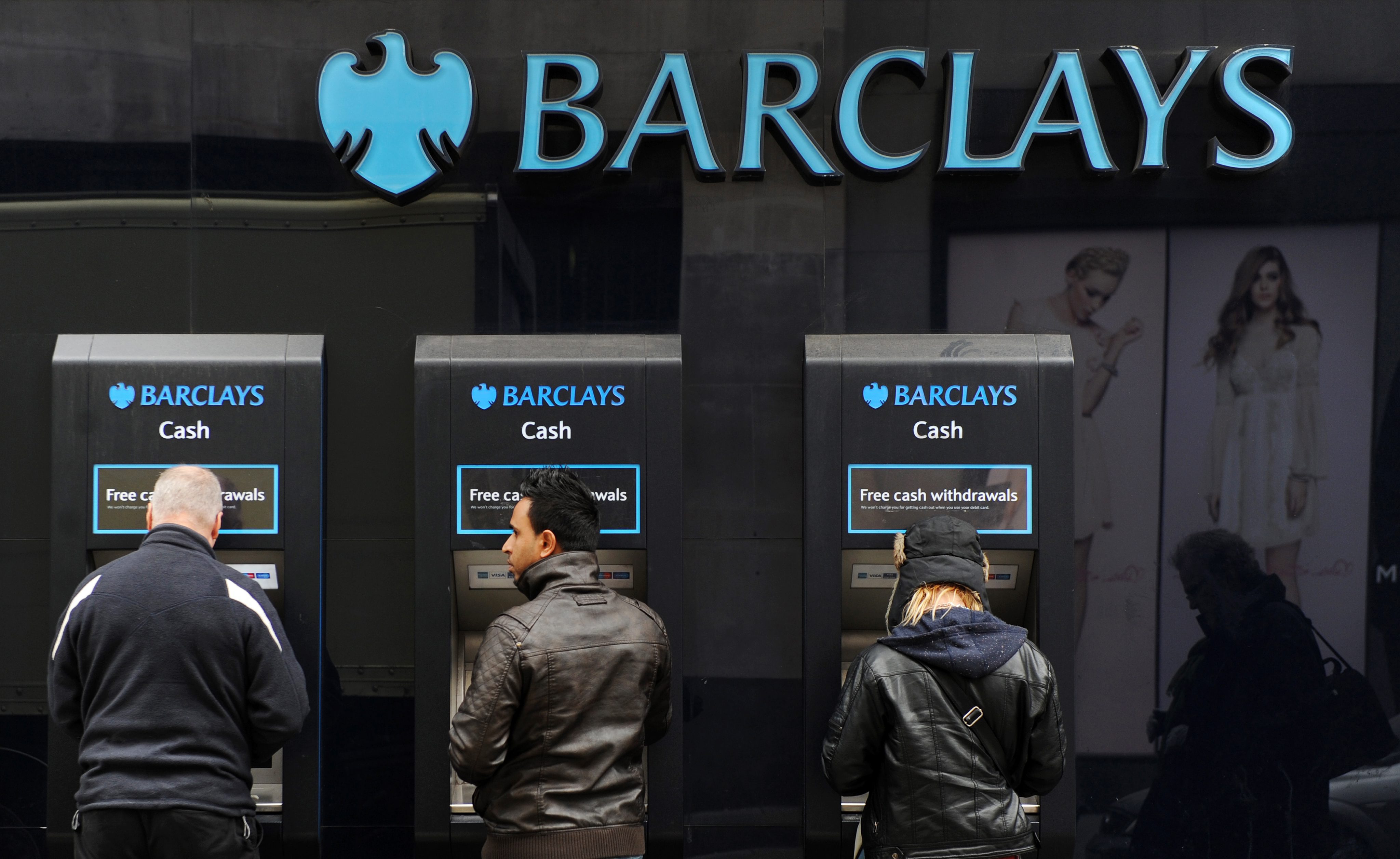 epa04469830 (FILE) A file photo dated 03 Aprilo 2013 showing customers usin g ATM machines outside a Barclays bank branch in London, Britain. British bank Barclays PLC said 30 October 2014 it had set aside 500 million pounds (800 million dollars) to cover any costs arising from global investigations into the alleged manipulation by banks of currency trading. Britain's Serious Fraud Office and Financial Conduct Authority are among regulators around the world looking into allegations that traders used online chatrooms to rig prices. Barclays is among the banks that have suspended currency traders for alleged market manipulation. The provision for possible fines was contained in results that showed a rise in pre-tax profits for the first nine months of the year to 3.7 billion pounds, from 2.8 billion pounds in the corresponding period a year earlier. EPA/ANDY RAIN
