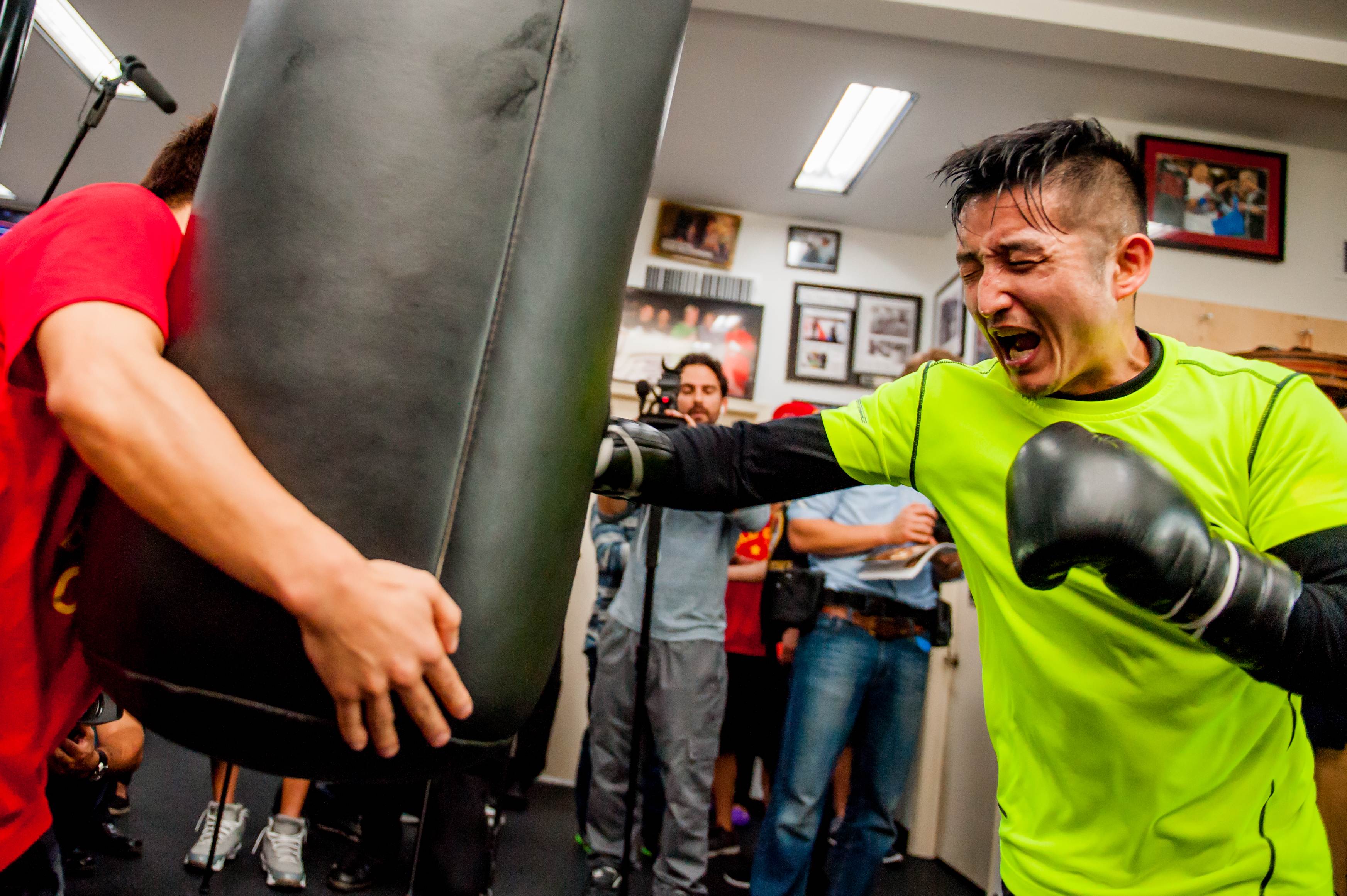 HOLLYWOOD, CA - FEBRUARY 17: Boxer Zou Shiming of China works out with a trainer during a media workout session at Wild Card Boxing Club on February 17, 2015 in Hollywood, California. Jonathan Moore/Getty Images/AFP == FOR NEWSPAPERS, INTERNET, TELCOS & TELEVISION USE ONLY ==