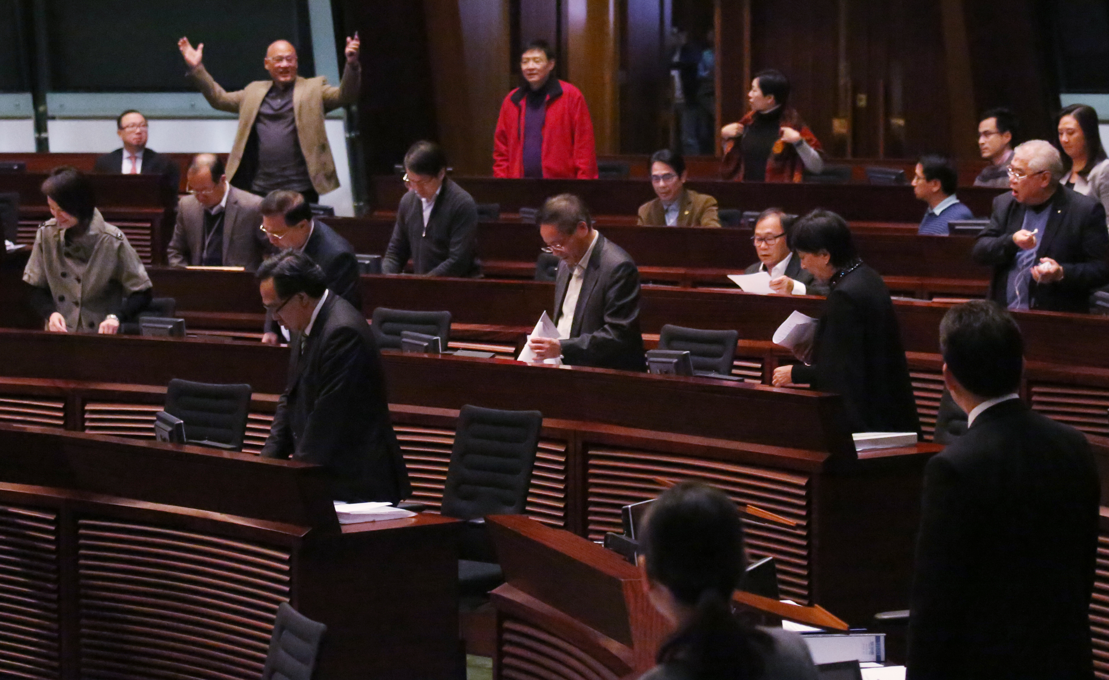 Legislator Albert Chan Wai-yip (upper left corner) gestures after the Legco meeting on second reading of the controversial Copyright (Amendment) Bill in Legco Chamber in Tamar has been stopped. The meeting was adjourned due to the lack of quorum. 07JAN16 SCMP/Nora Tam
