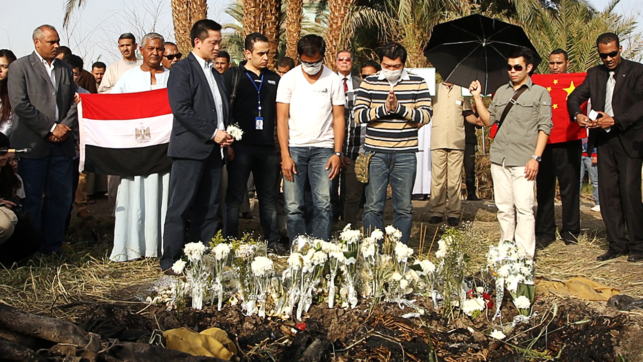 Relatives of victims attend a mourning ceremony at the crash site in Luxor. Photo: Sam Tsang
