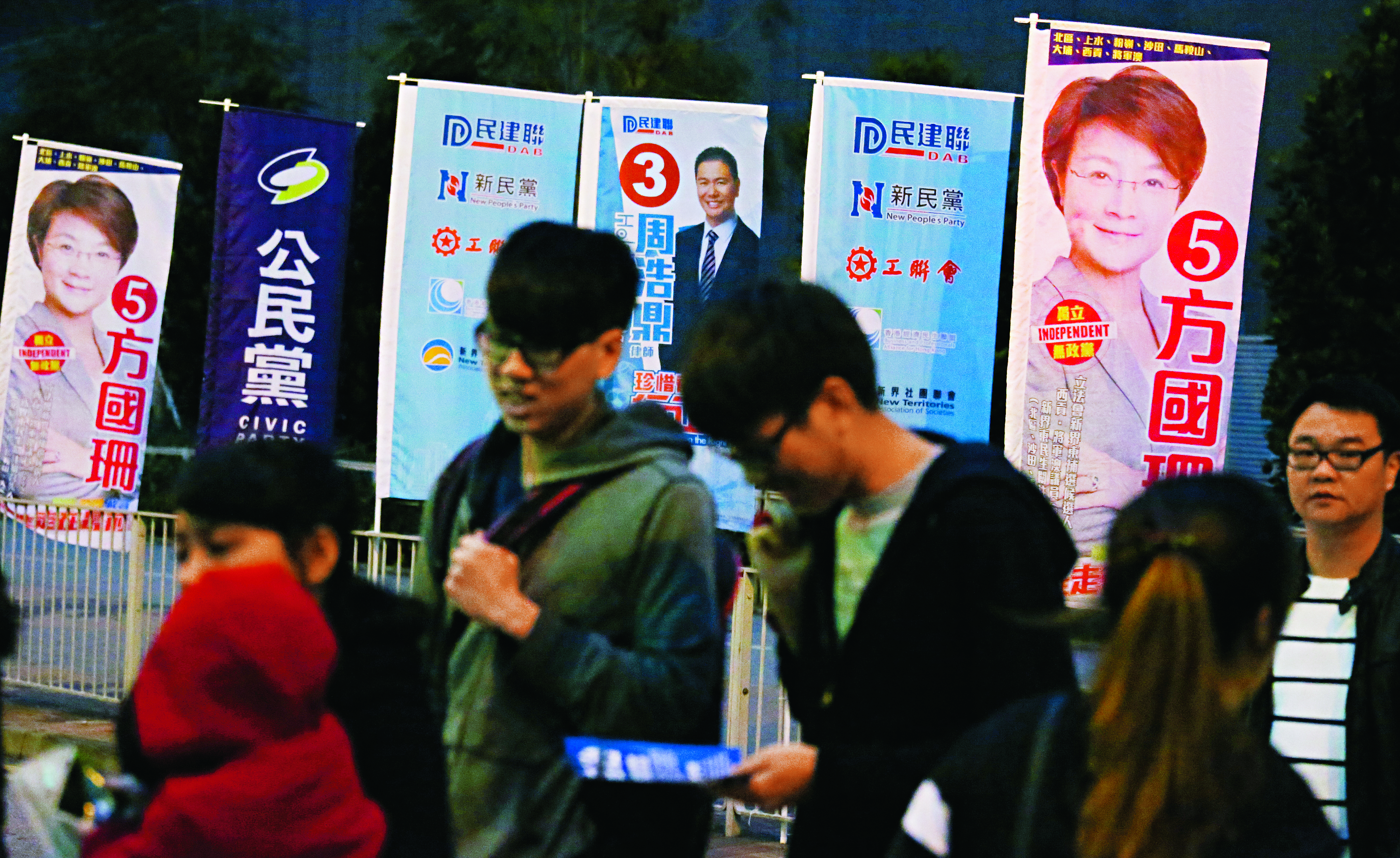 Rival election banners hide the complex political dynamics at work in New Territories East. Photo: Nora Tam