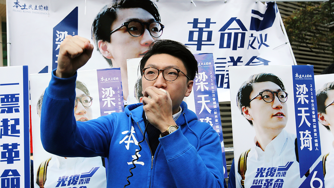 Edward Leung Tin-kei, who finished a respectable third, canvassing before the poll. Photo: Edward Wong