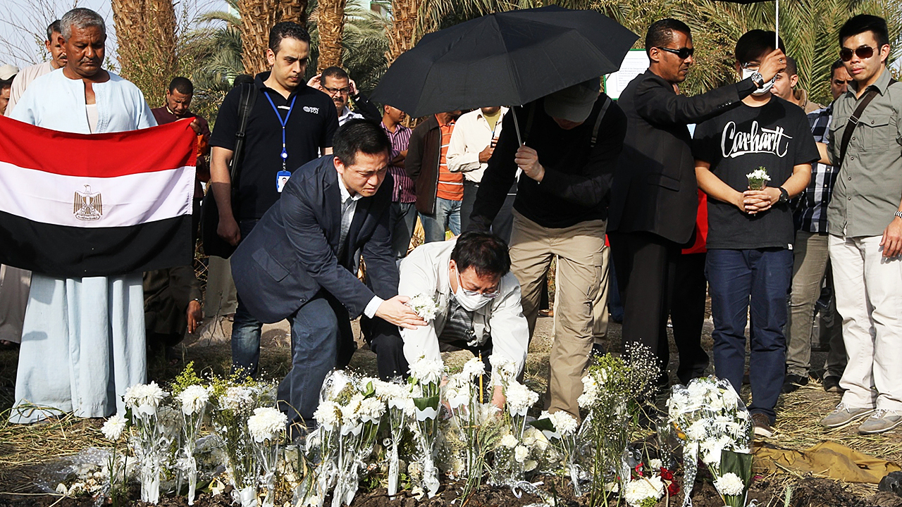Family members of victims of the hot air balloon accident attend a mourning ceremony at the crash site. Photo: Sam Tsang