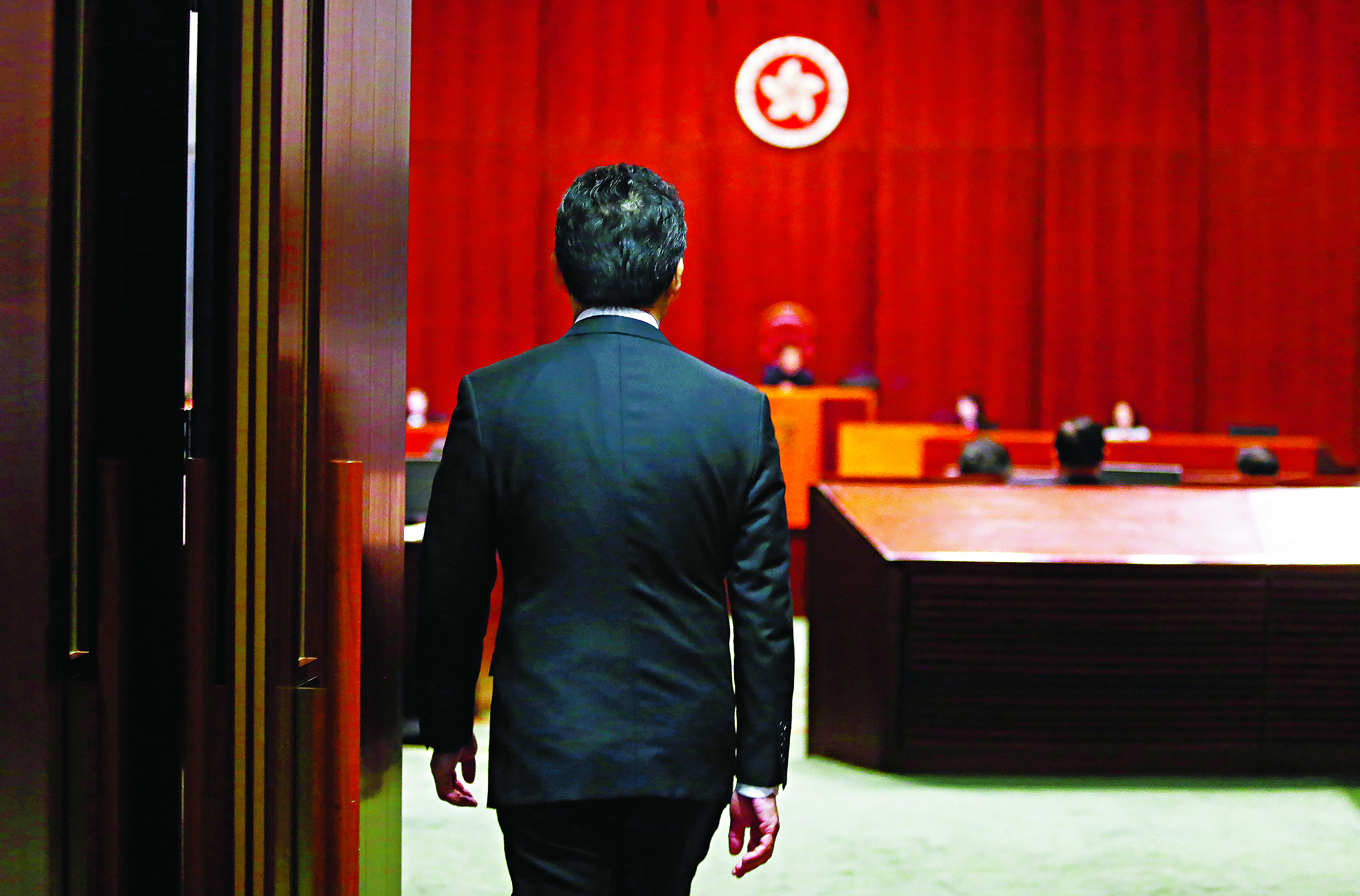 Commerce minister Greg So enters the Legco chamber for the long-running debate on the copyright bill. Photo: Sam Tsang