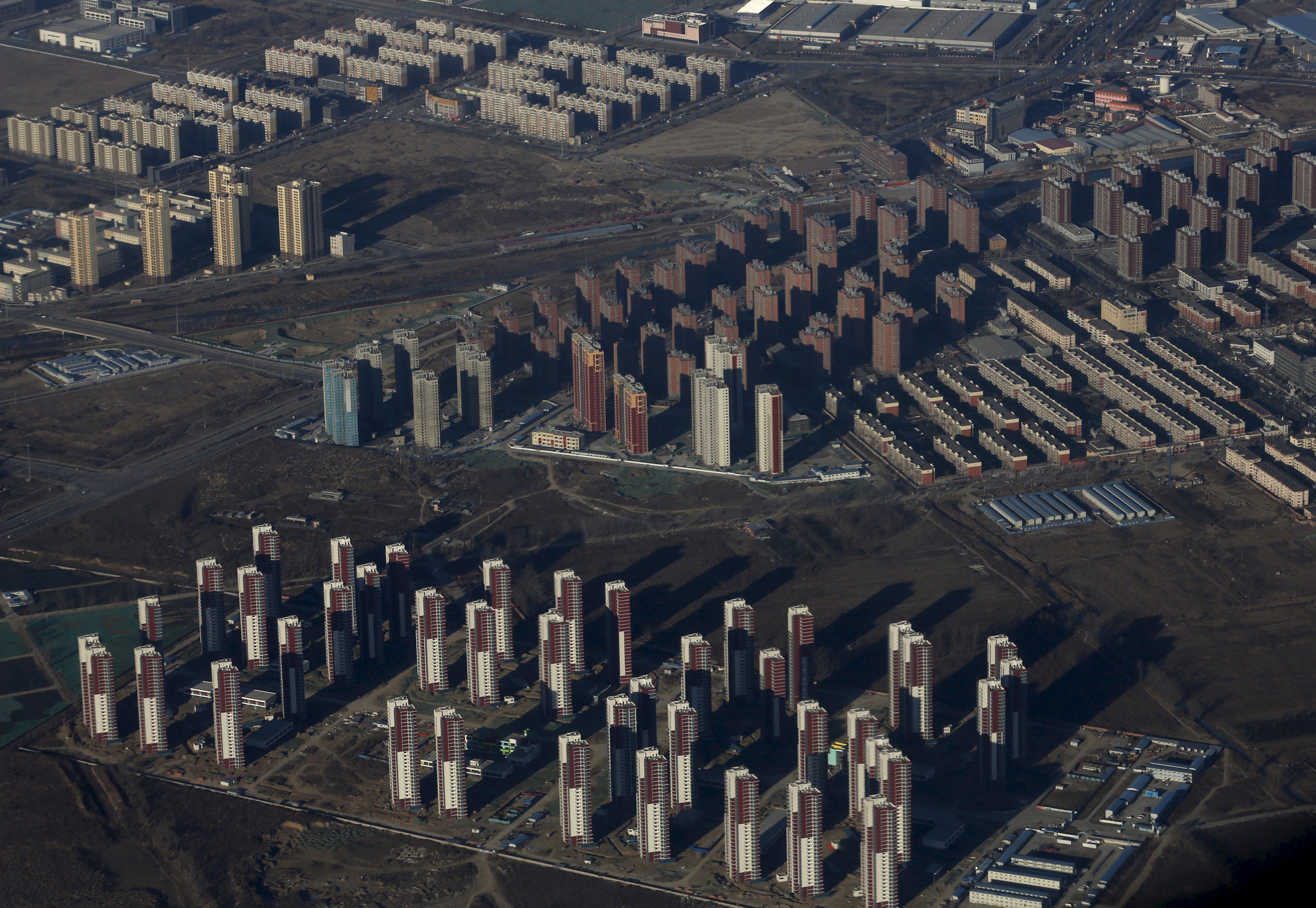 Apartments are seen from a plane on the outskirts of Beijing. Corporates making speculative investments in real estate is not a new phenomenon. Photo: Reuters