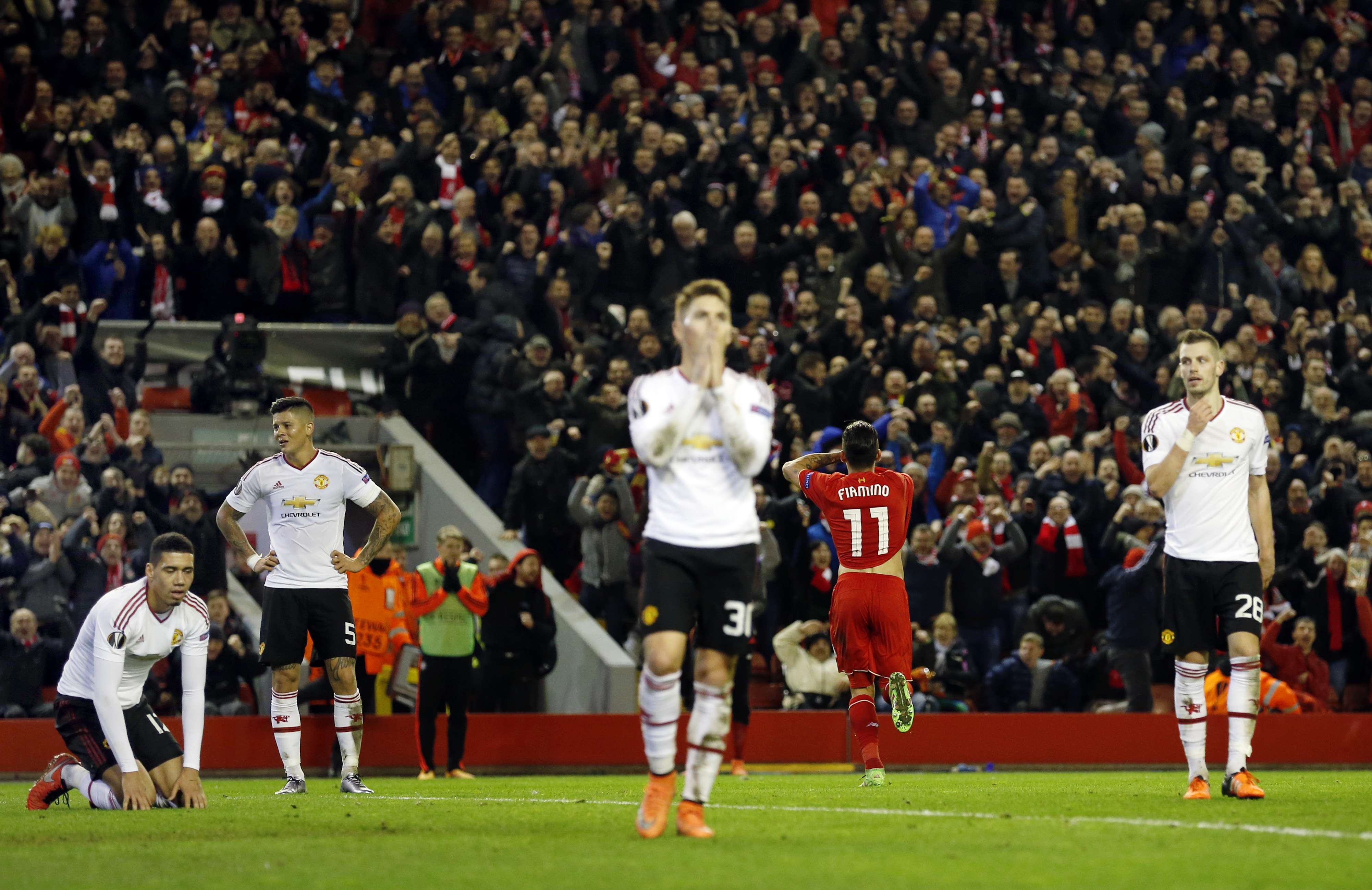 Despondent Manchester United players react as Roberto Firmino puts Liverpool 2-0 in front at Anfield. Photo: Reuters