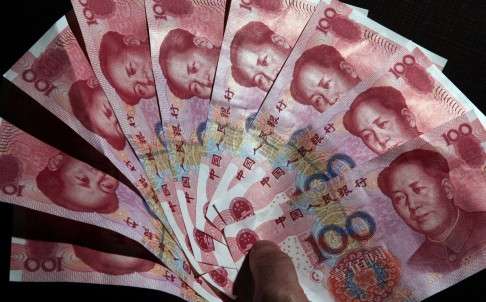 A former primary school student who stole 10 Chinese cents from her classmate more than 40 years ago tried to hand 10,000 yuan to her when they met again on Sunday. Photo: EPA