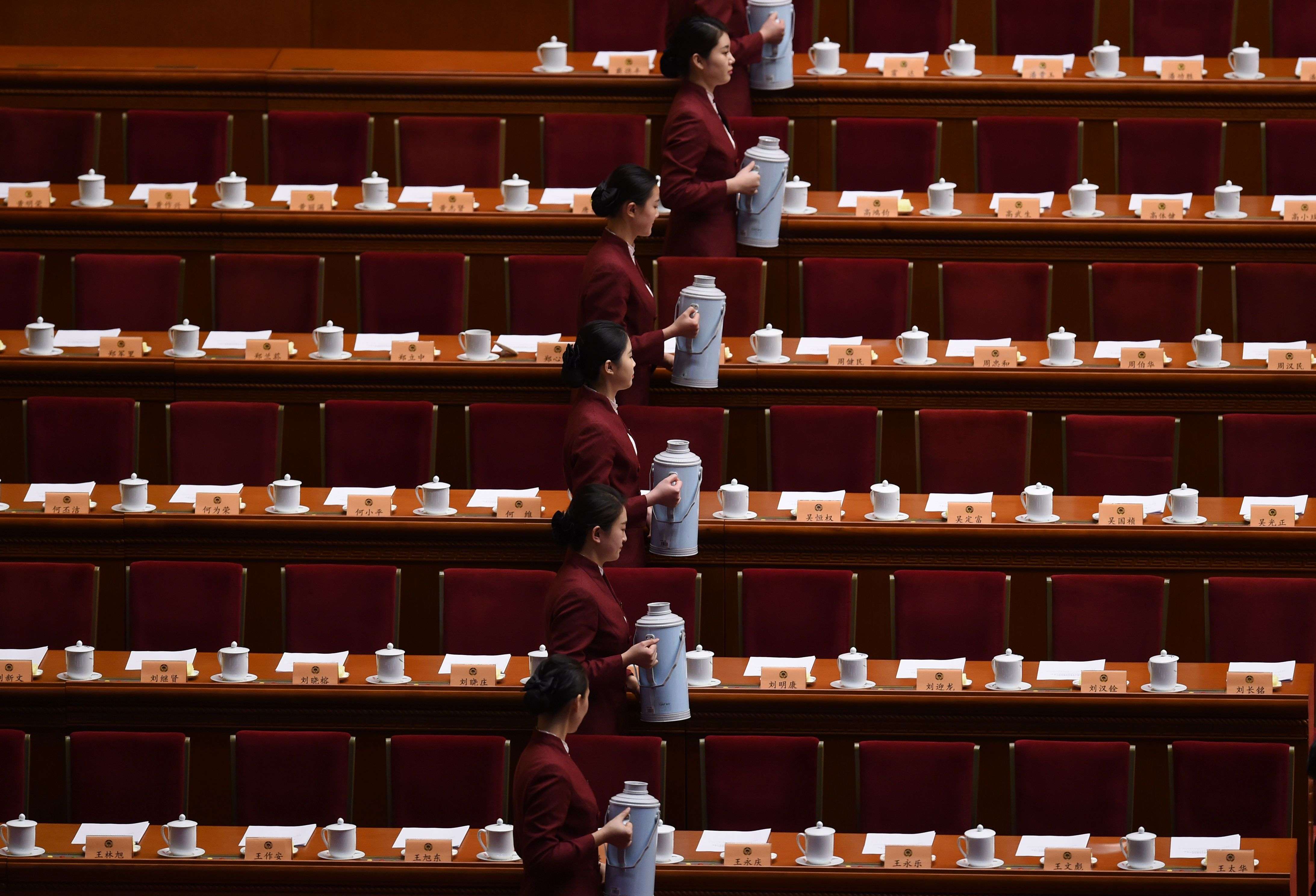 Attendants prepare tea for China’s leaders before the Chinese People's Political Consultative Conference closes at Beijing’s Great Hall of the People. Photo: AFP
