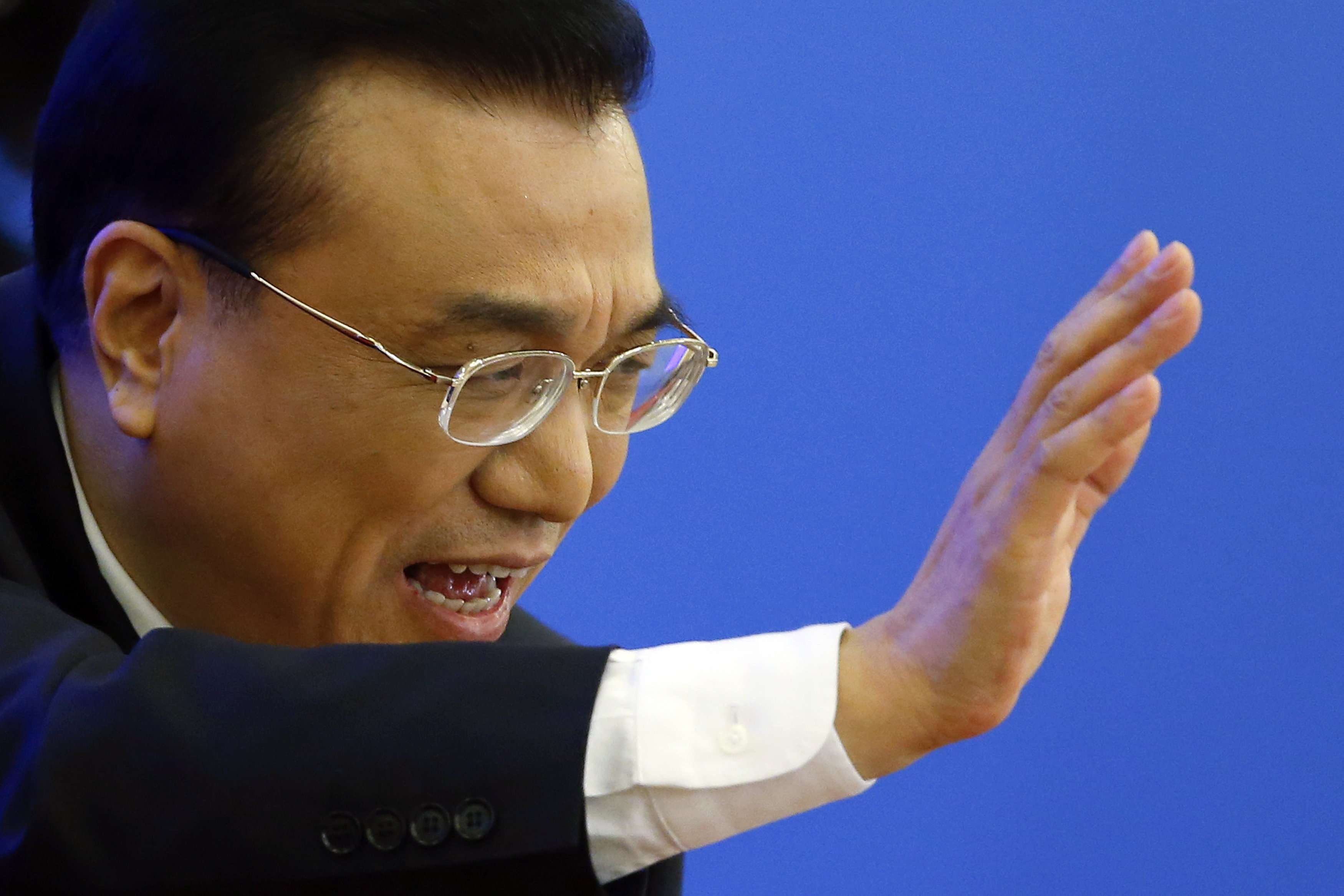 China's Premier Li Keqiang waves as he leaves a news conference after the closing ceremony of the National People's Congress on Wednesday. Photo: Reuters