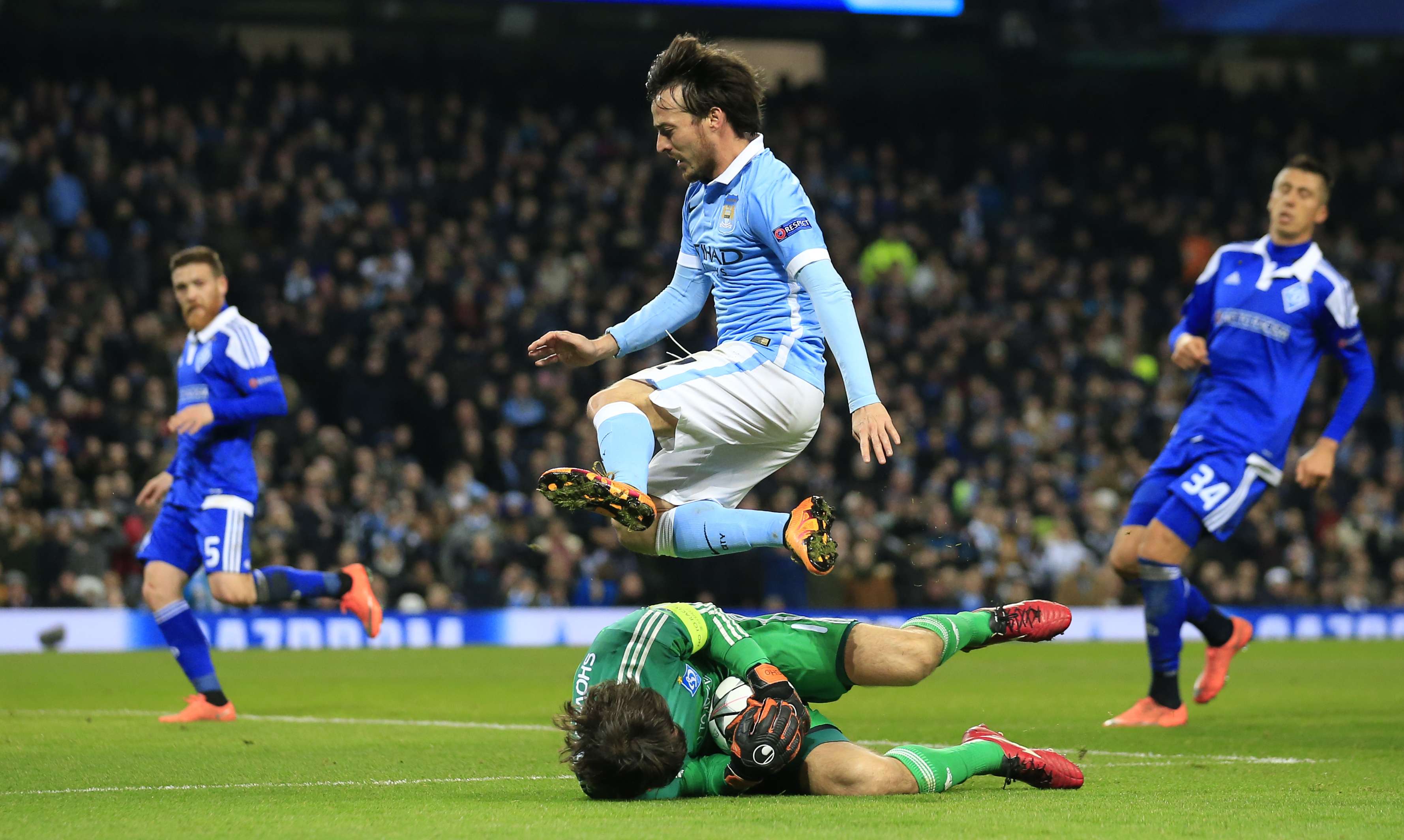 Manchester City's David Silva leaps over Kiev goalkeeper Oleksandr Shovkovskiy . Photo: AP