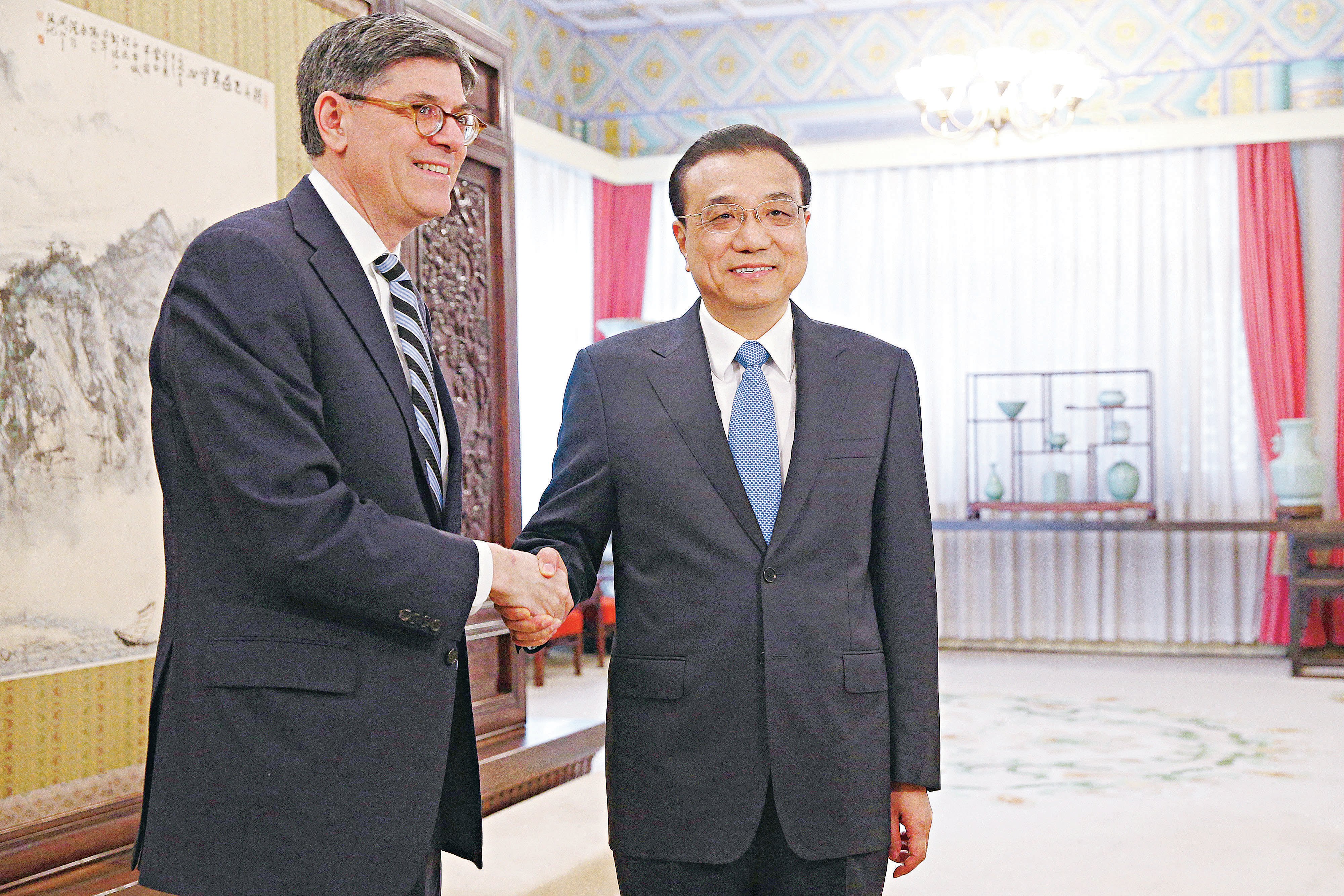 US Treasury Secretary Jacob Lew, left, shakes hands with Premier Li Keqiang in Beijing in February. Photo: AP