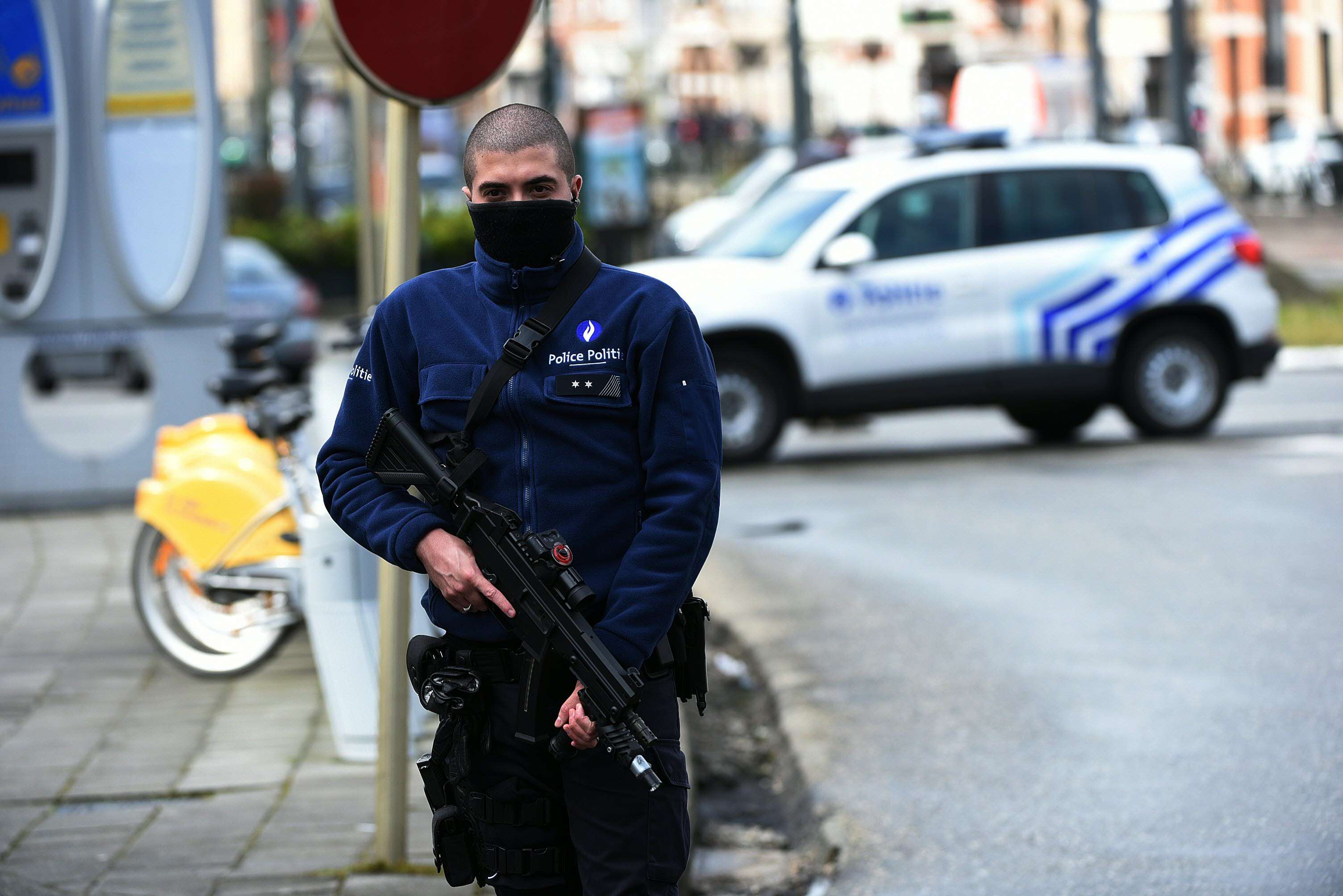 A police officer patrols in the Schaerbeek district of Brussels a fresh anti-terrorist operation. Photo: AFP