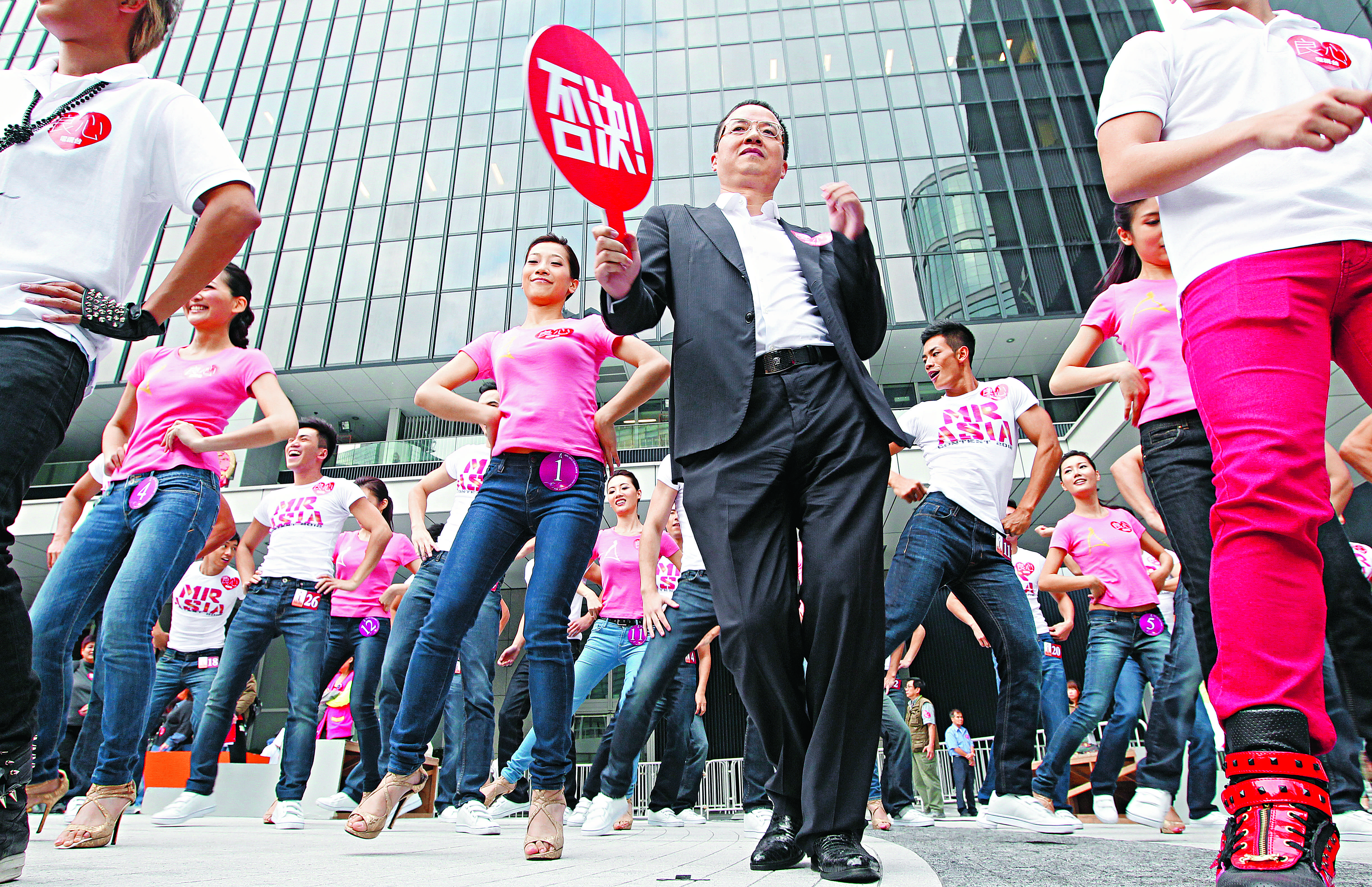 Mainland businessman Wong Ching shows off his dance moves outside the government headquarters. Critics say he is a major reason ATV died. Photo: Felix Wong