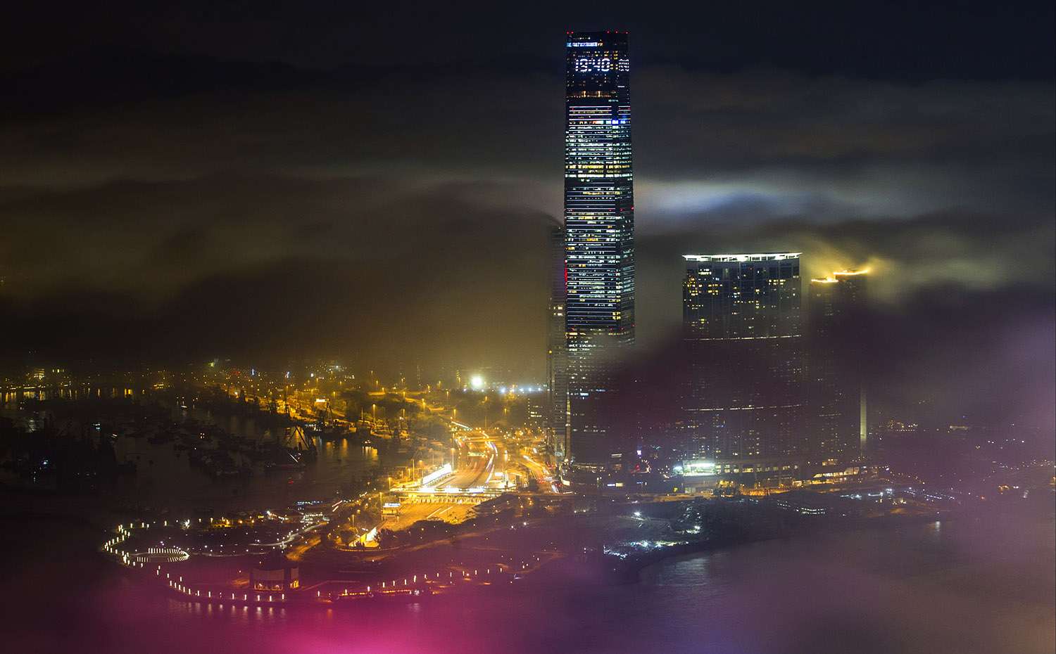 Kowloon’s ICC tower peeks through the fog that hides the rest of the northern part of the city. Photo: Bruce Yan